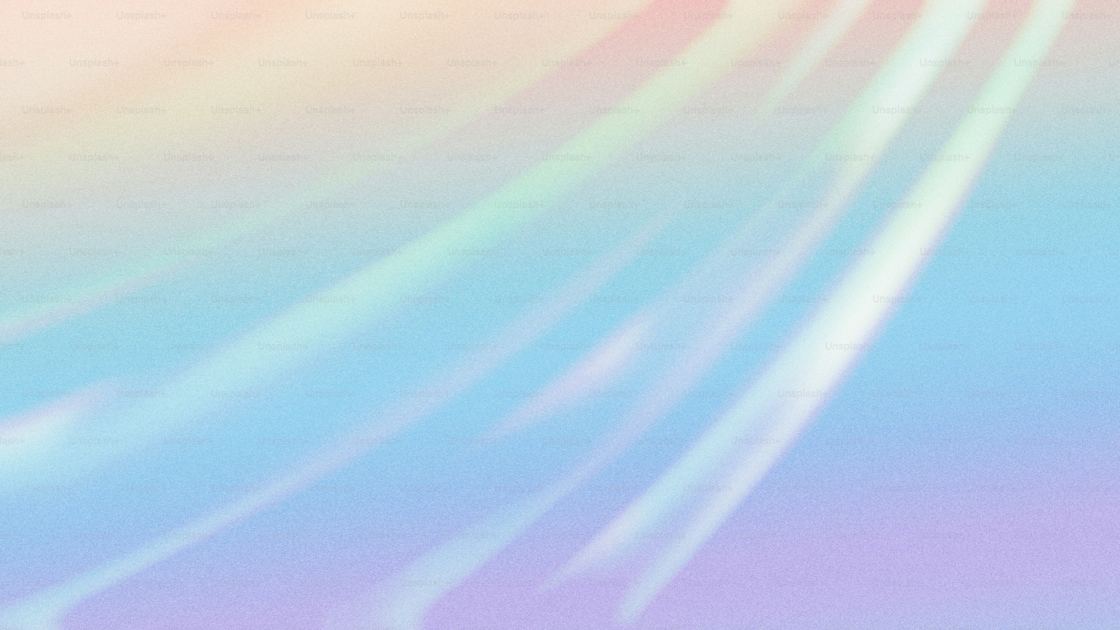 A blurry image of a rainbow colored background