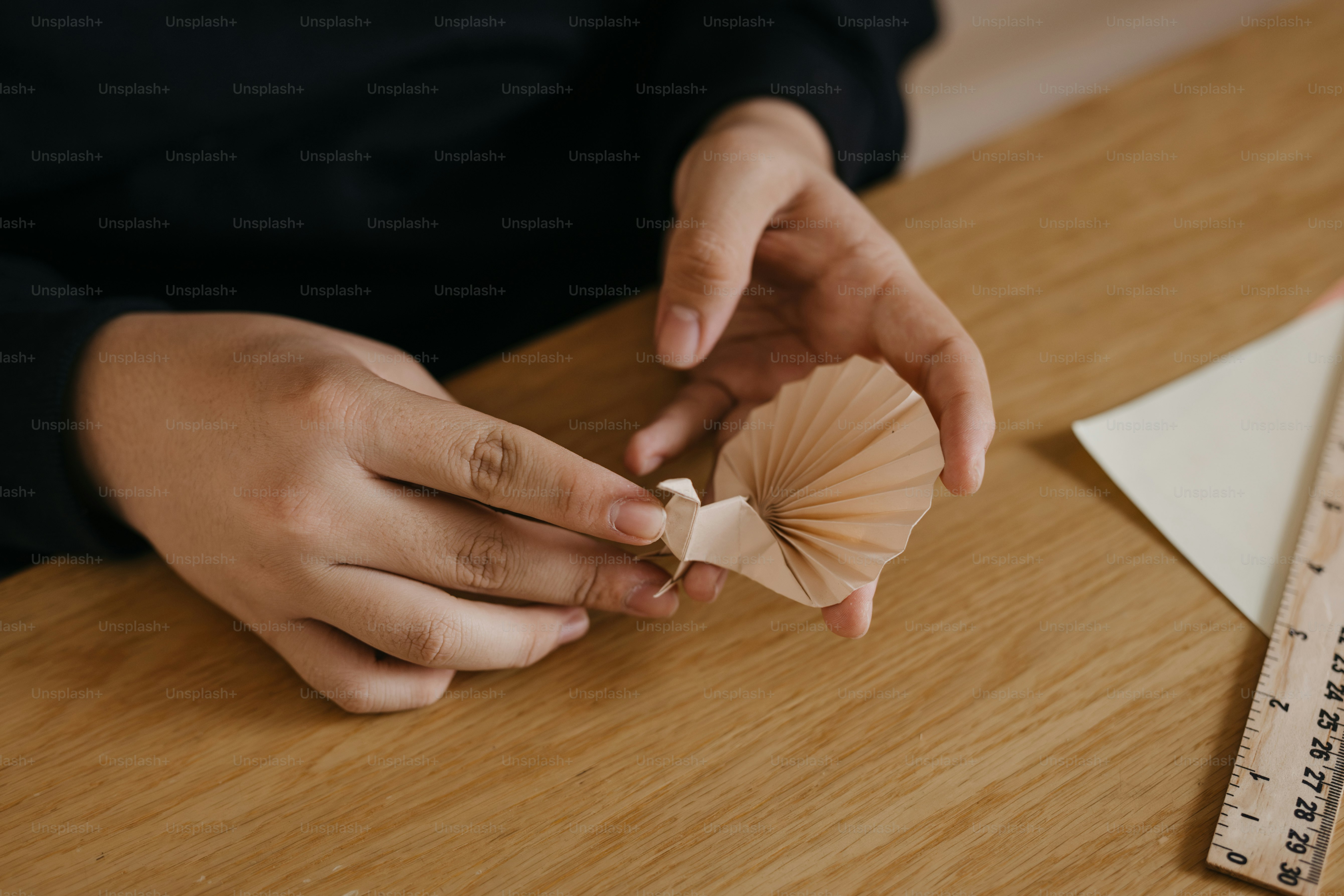 A person sitting at a table with a piece of paper