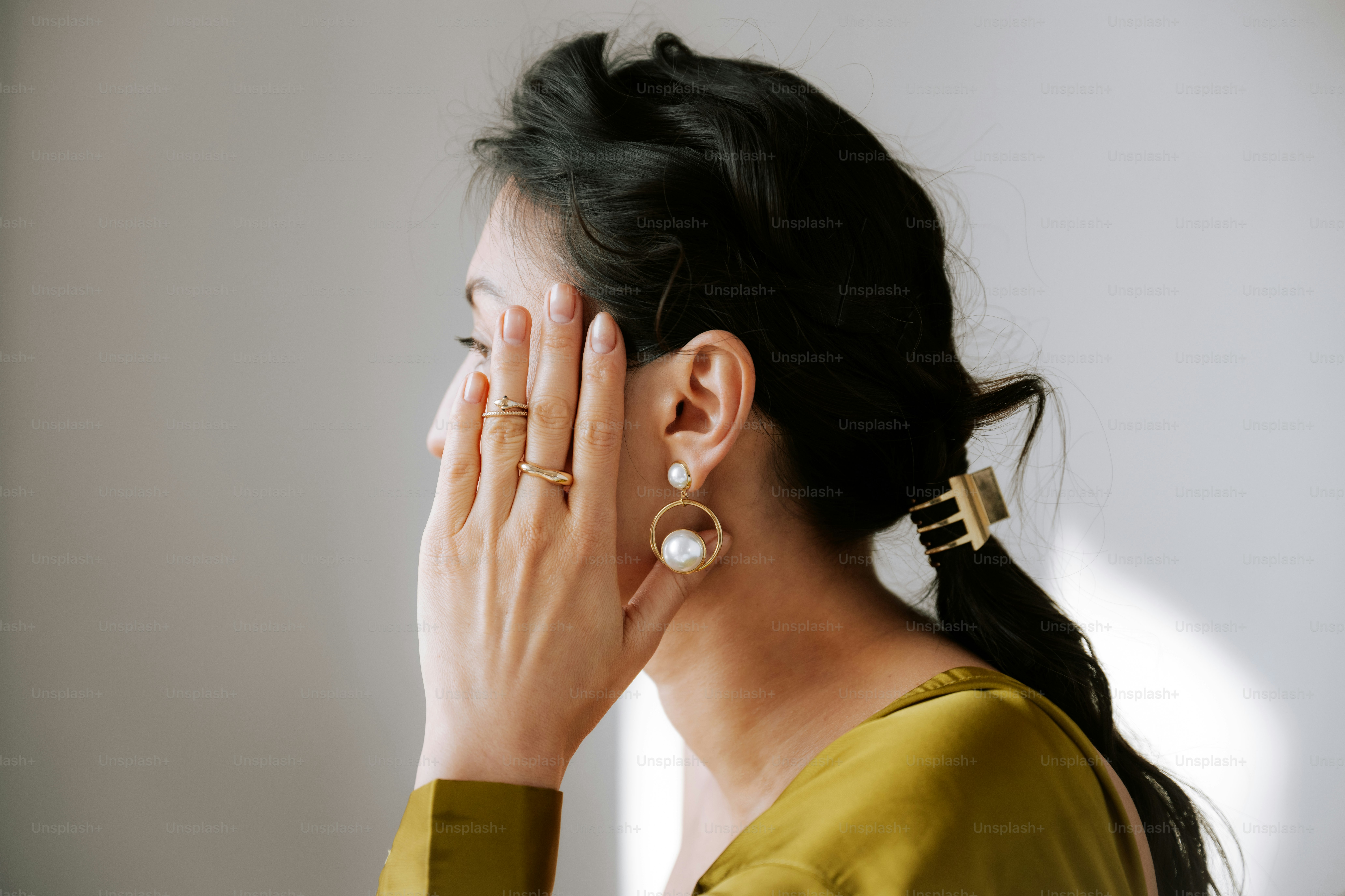 A woman covering her face with her hands photo – Minimal Image on Unsplash