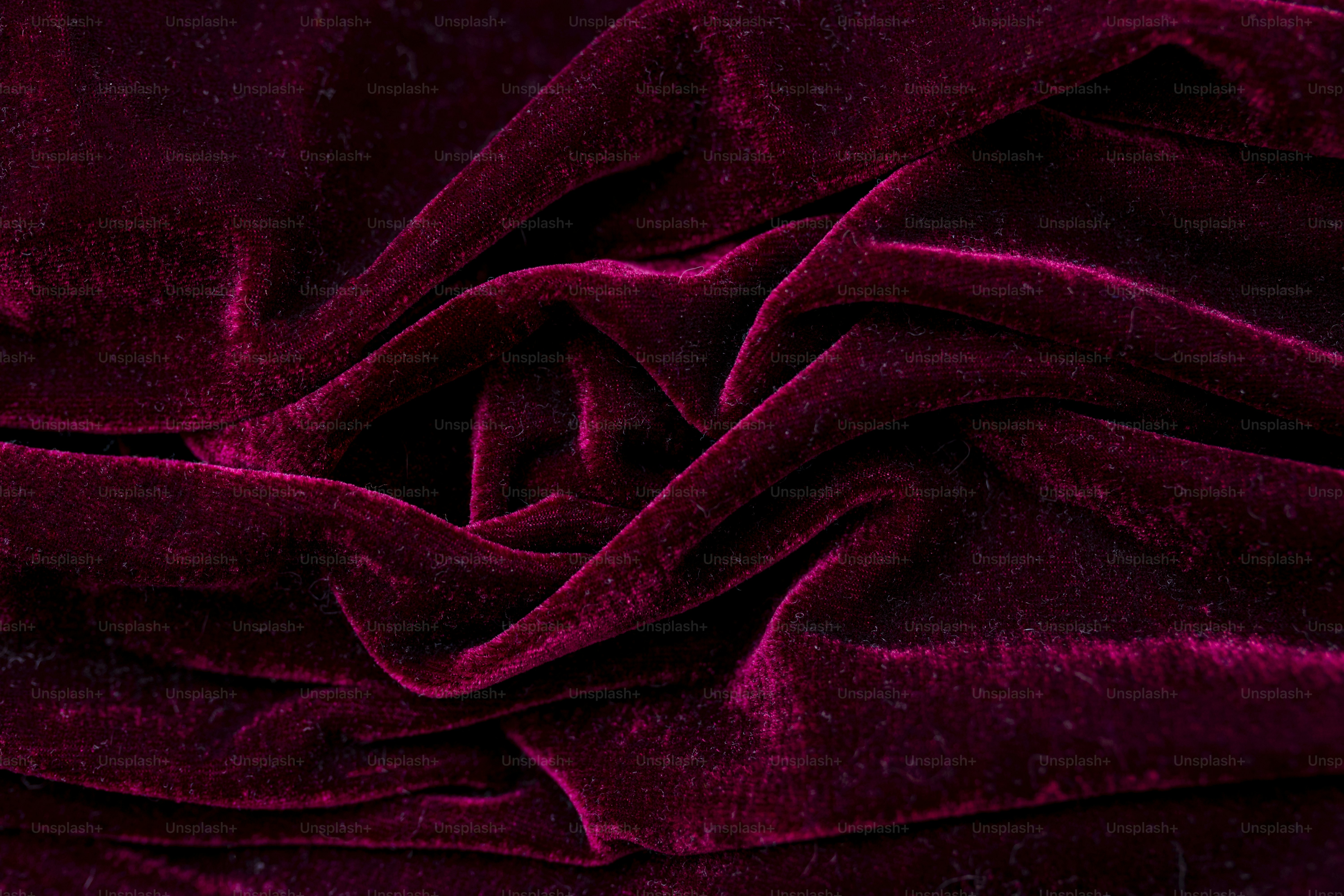 A close up of a red velvet fabric
