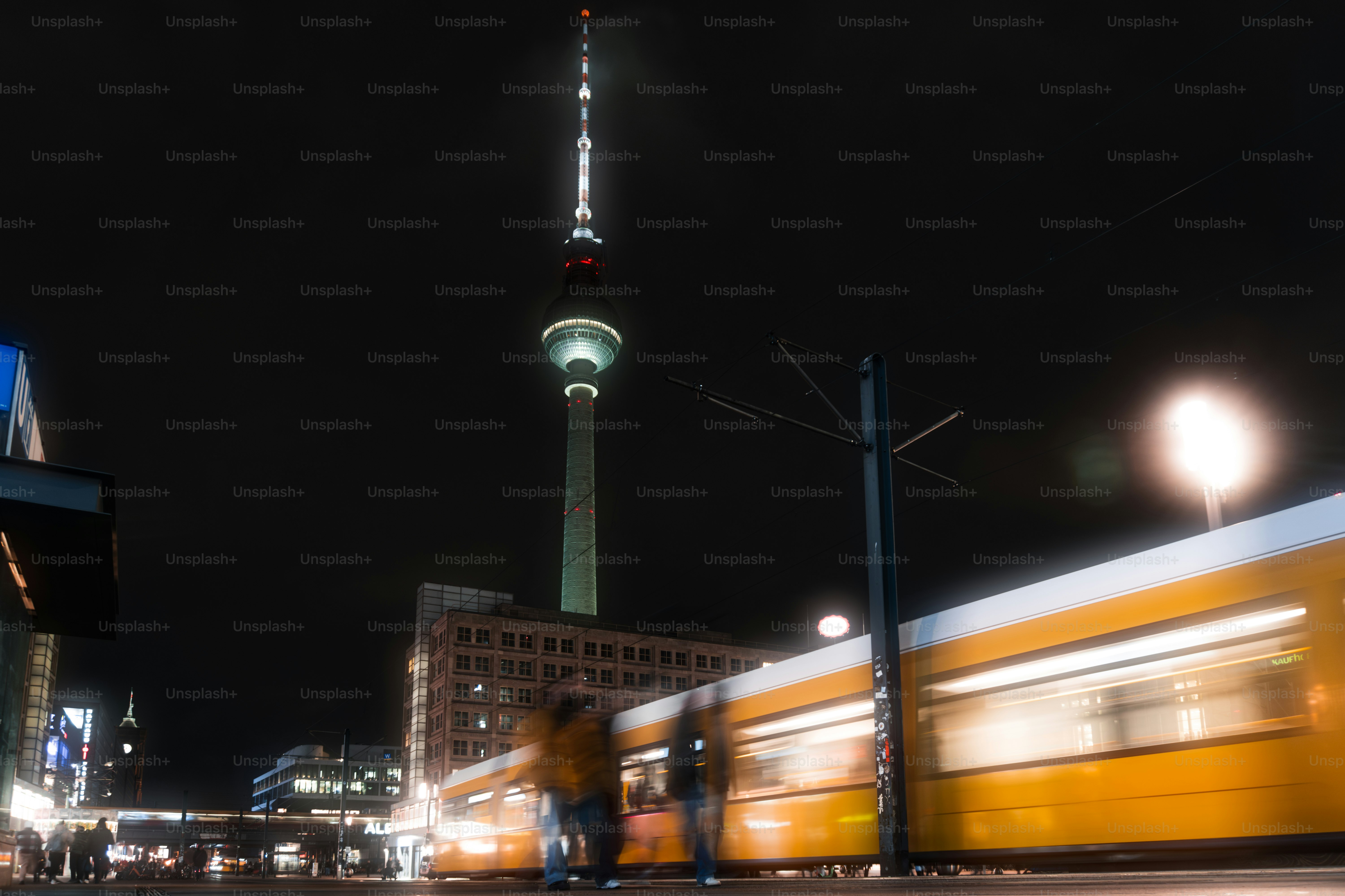 A blurry photo of a train passing by a building