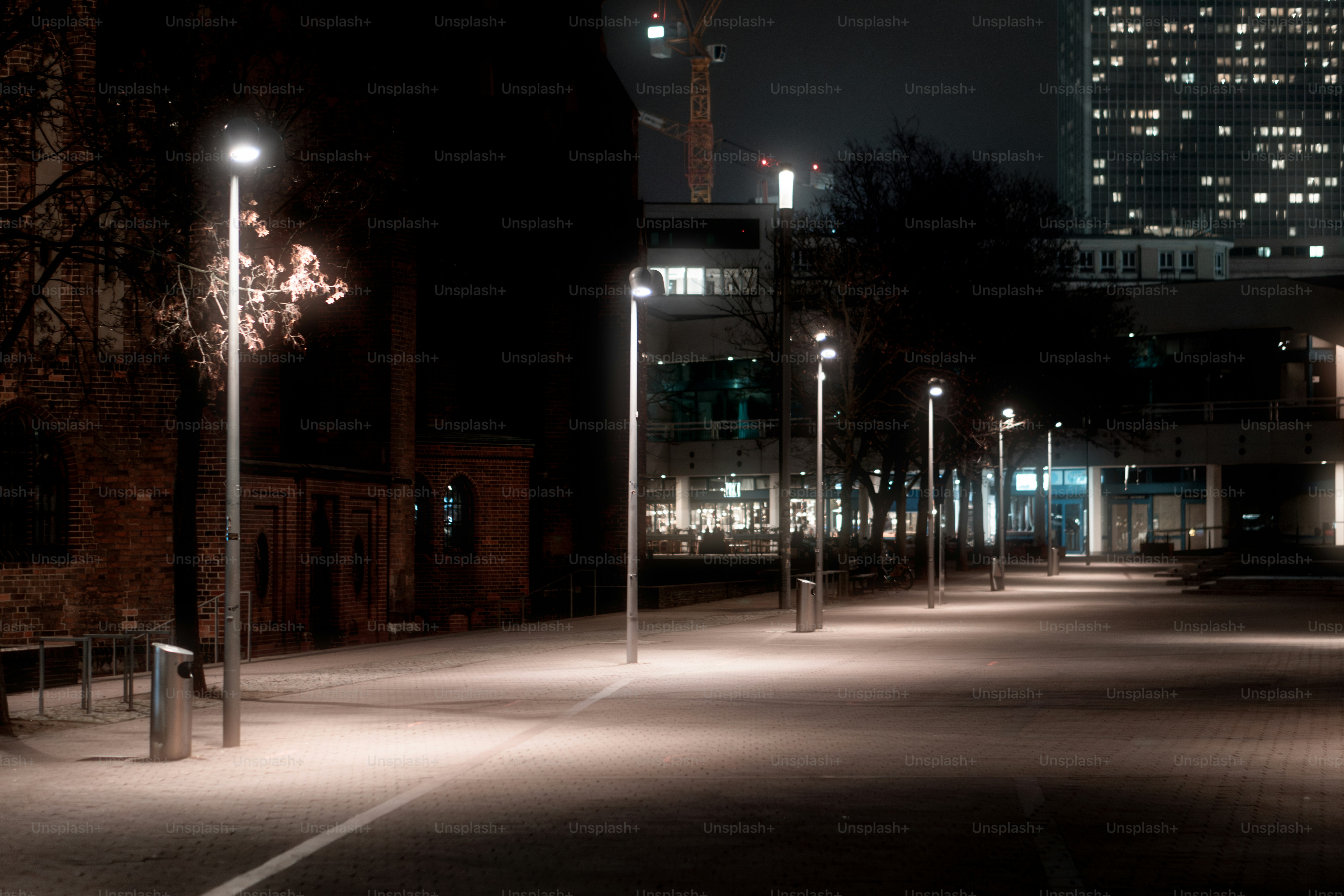 A city street at night with street lights