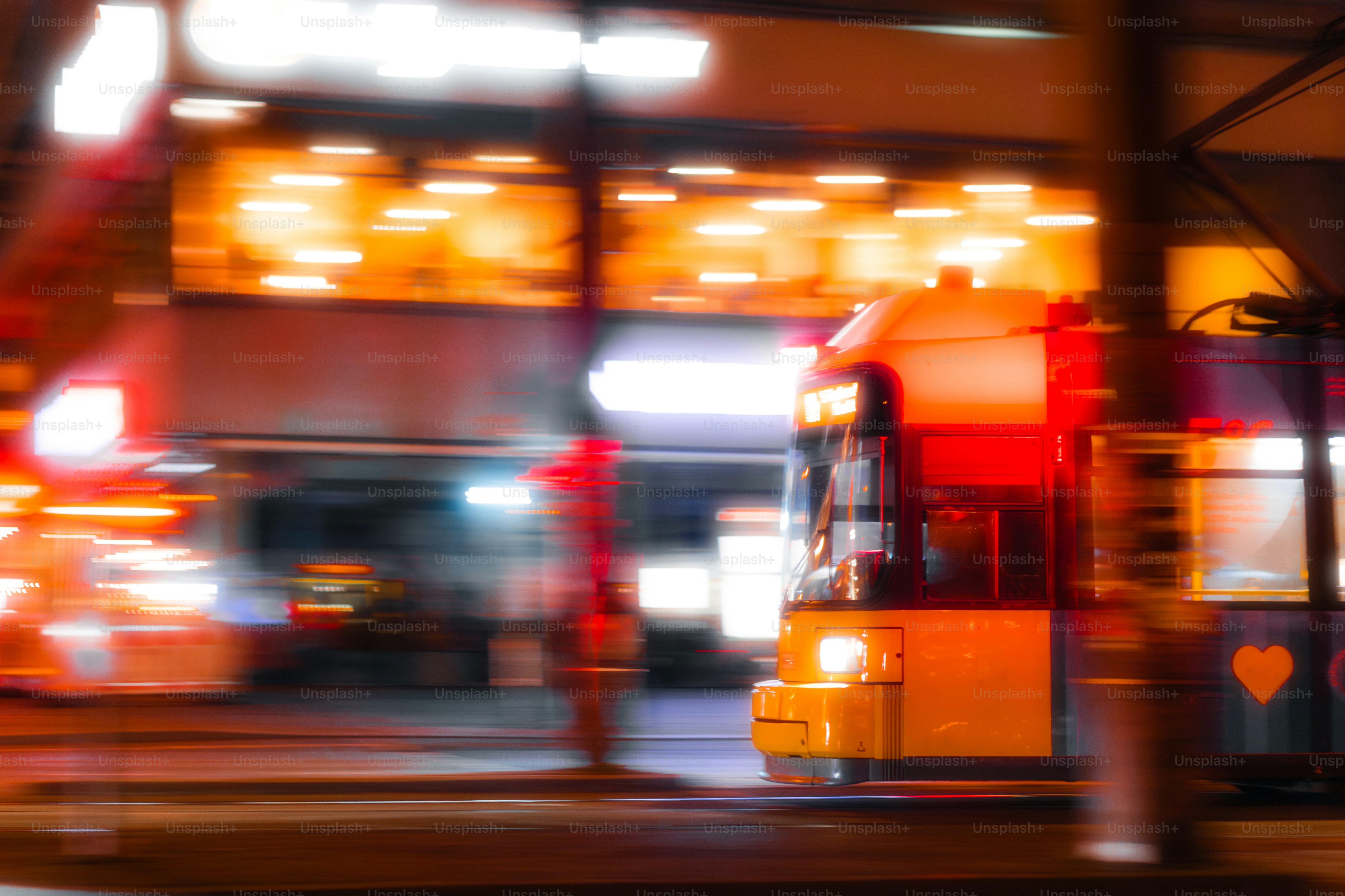 A blurry photo of a bus at a bus stop