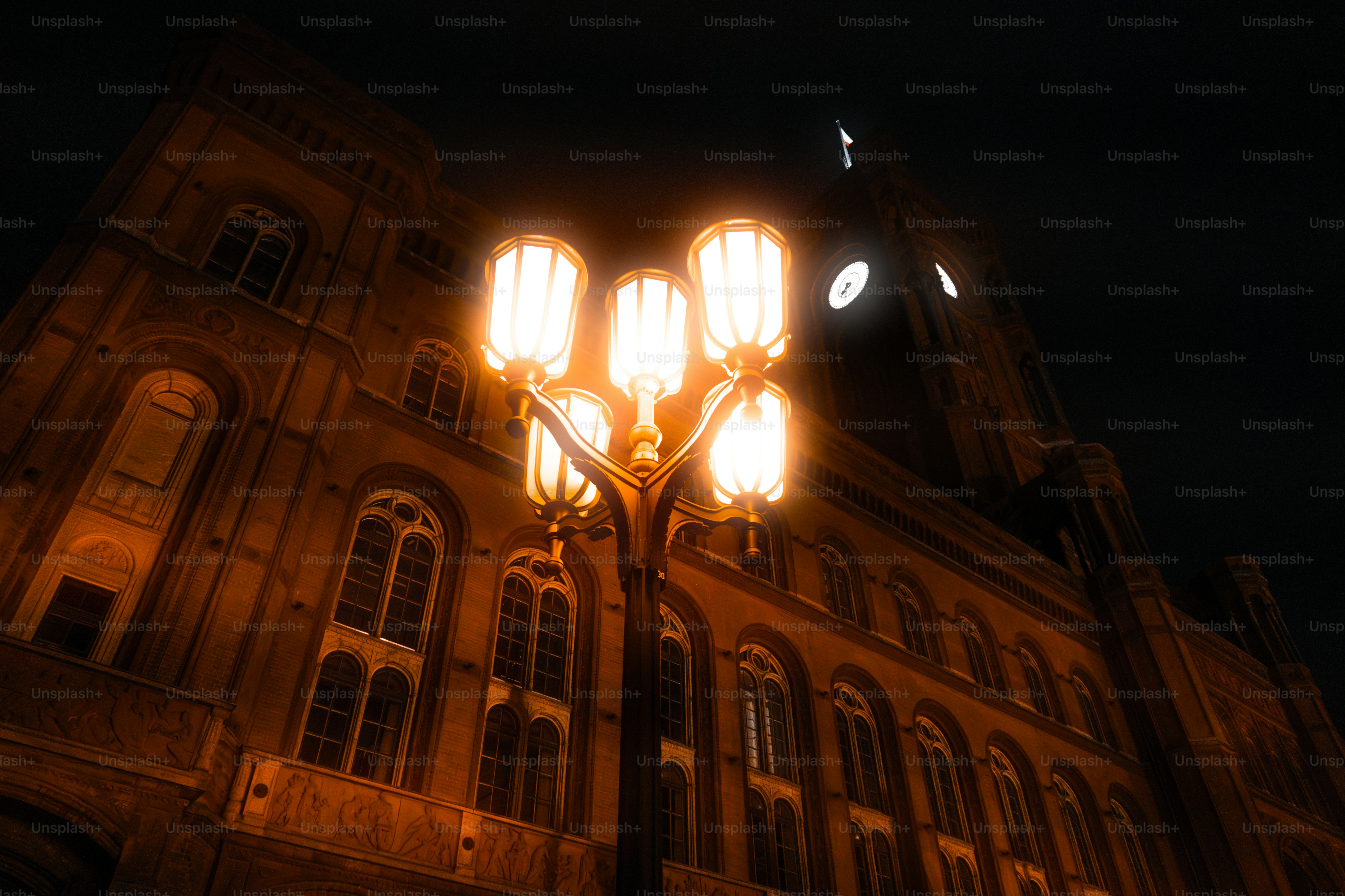 A street light in front of a large building