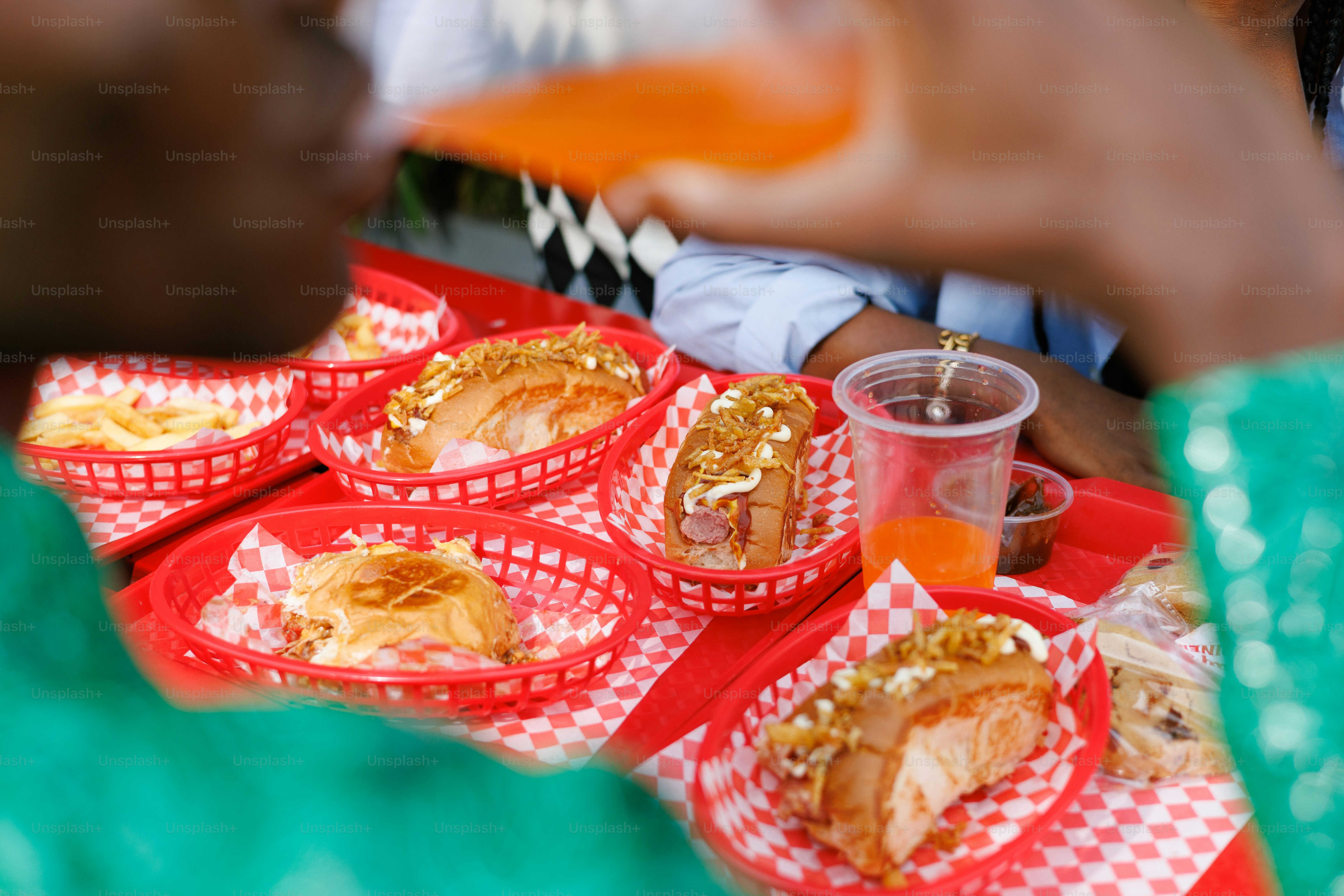 A group of people sitting around a table eating food