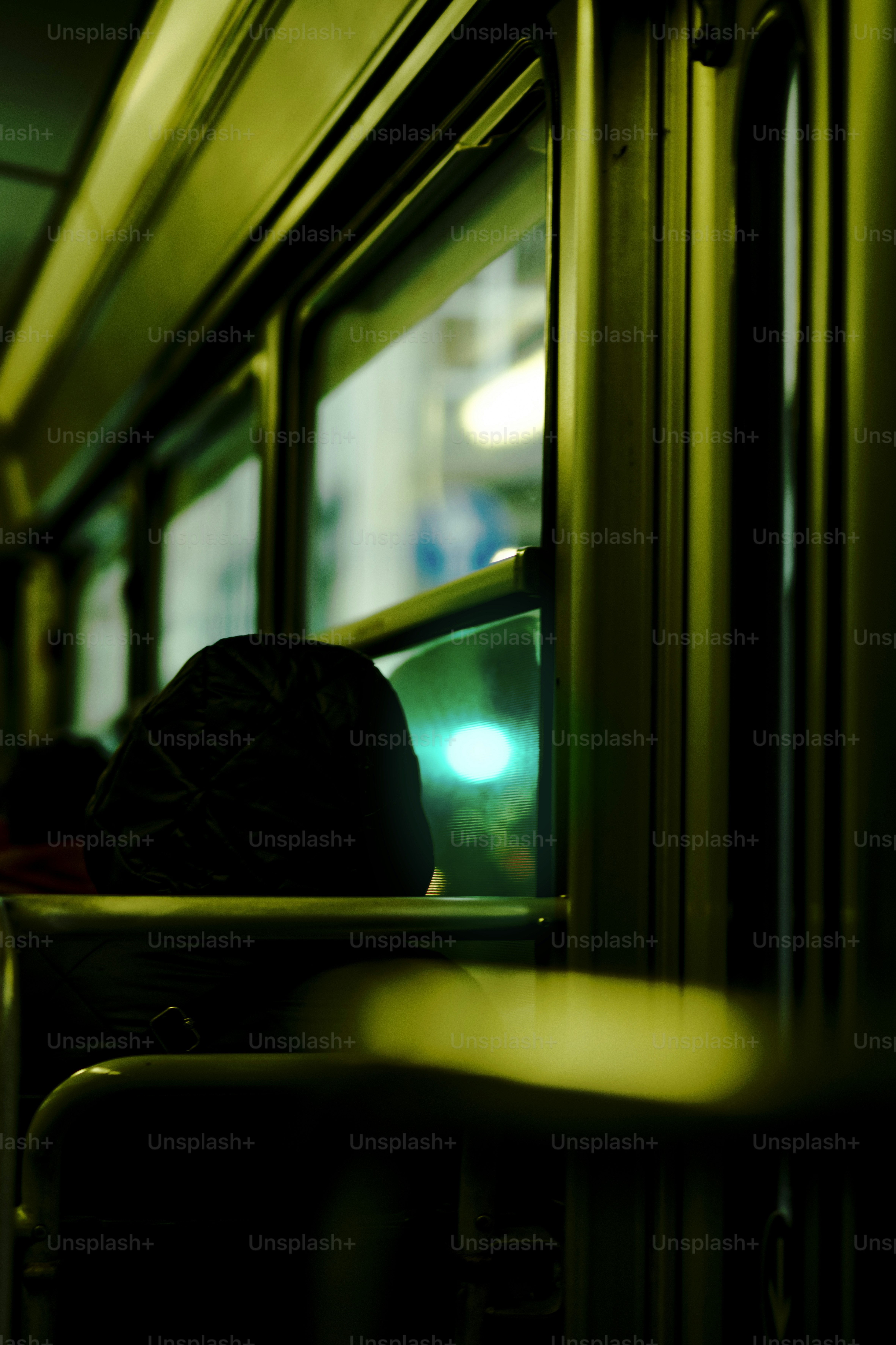 A green traffic light sitting on the side of a train
