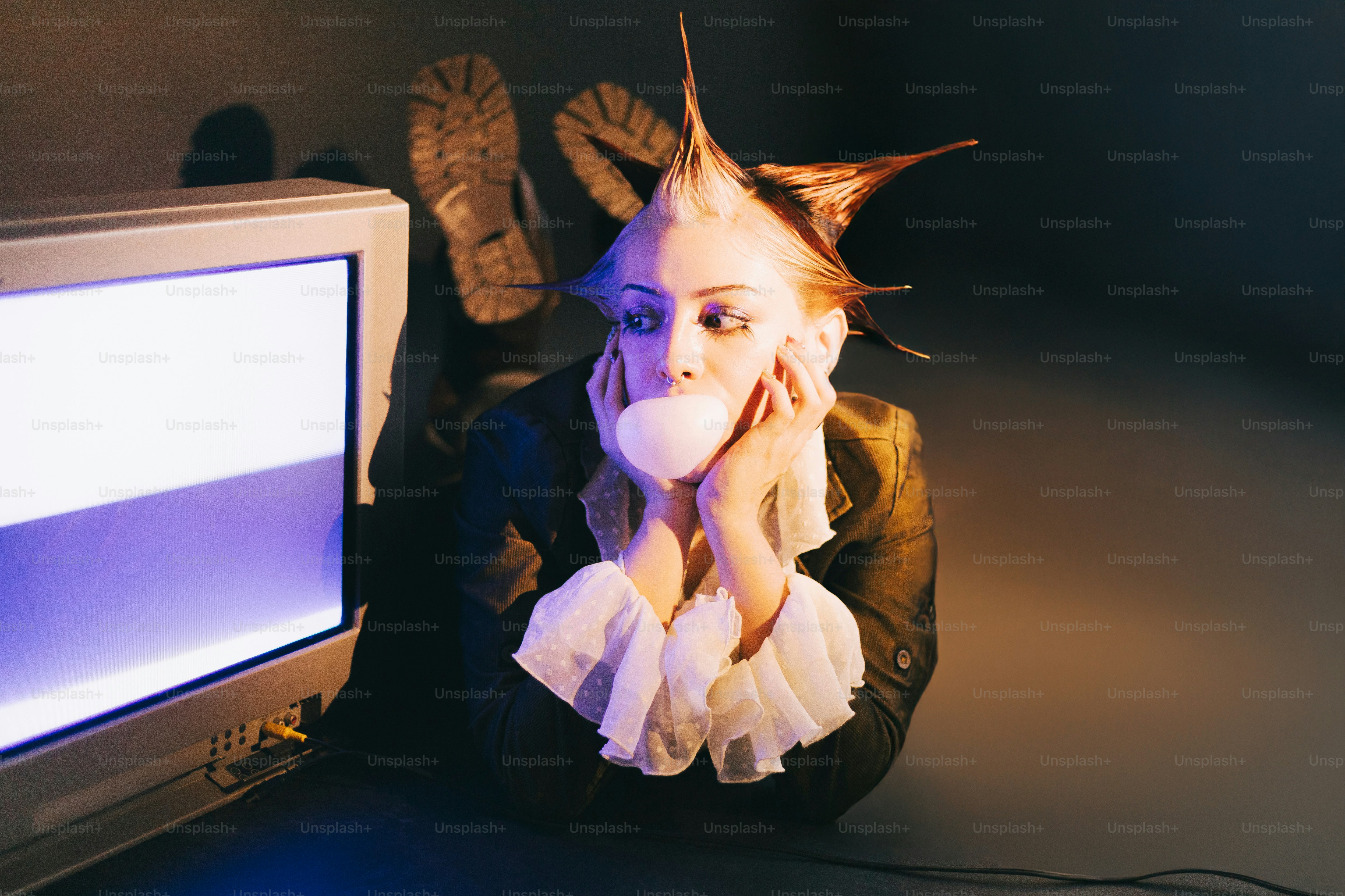 A woman sitting in front of a computer monitor