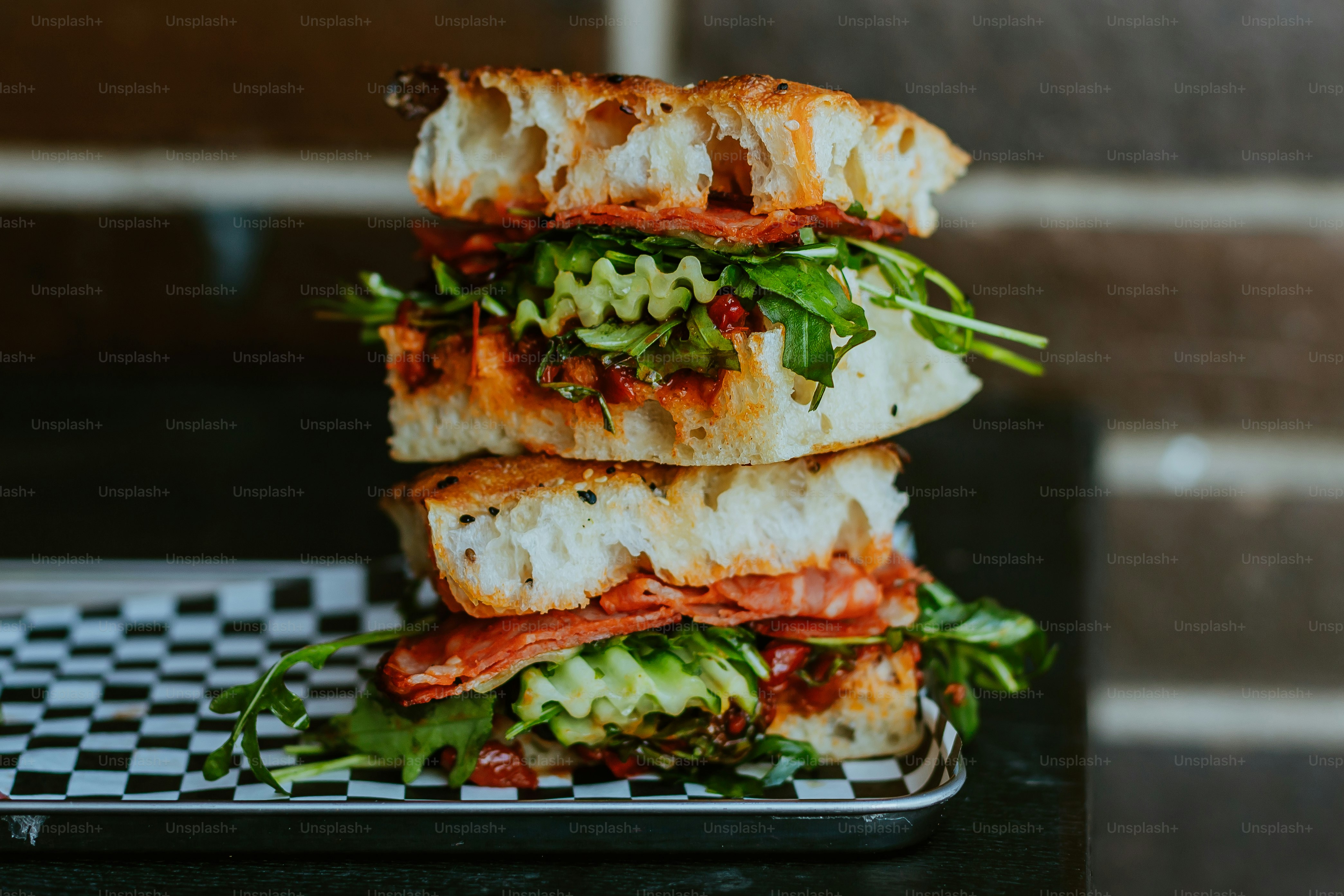 A stack of sandwiches sitting on top of a table
