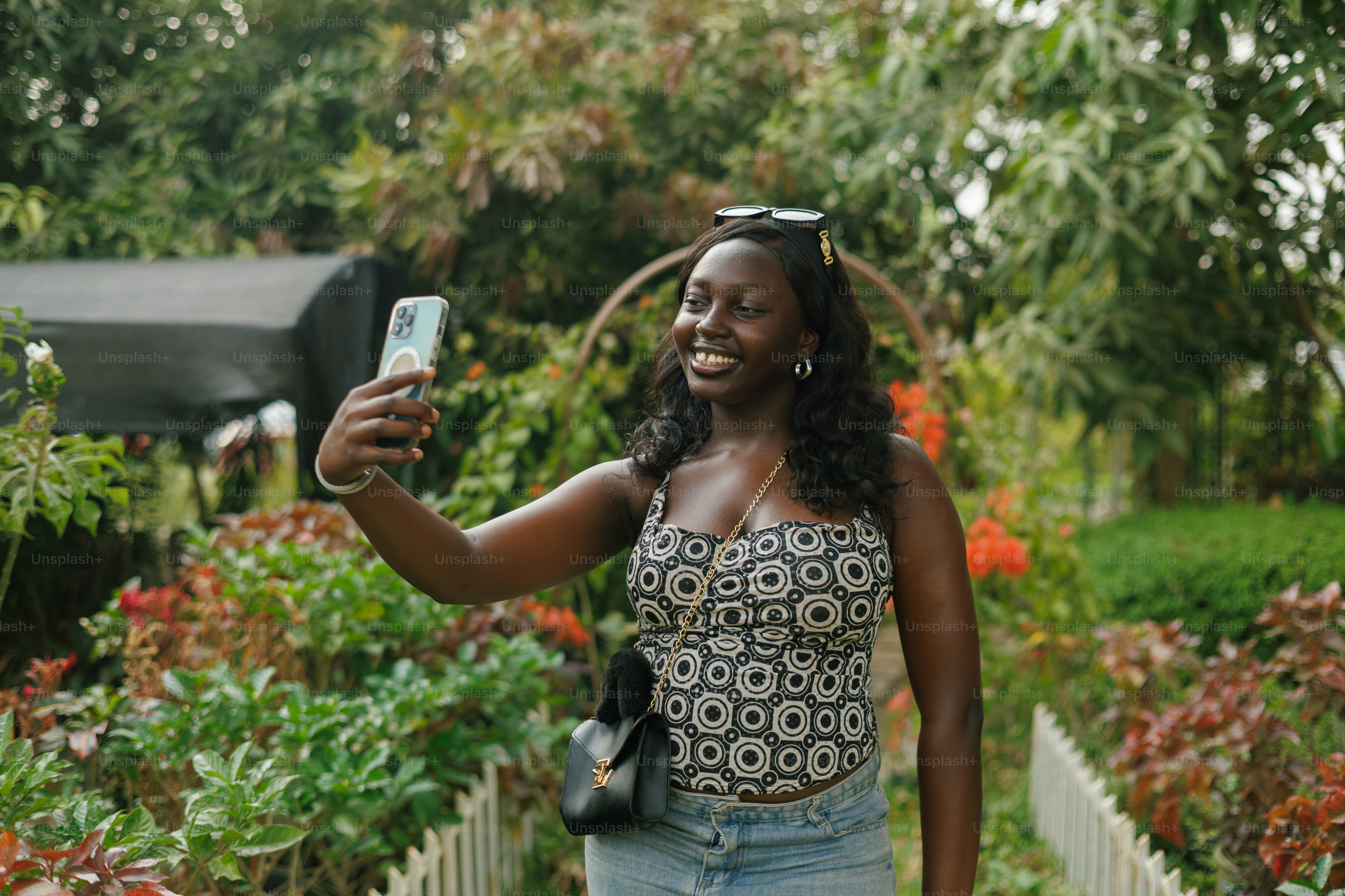 A woman taking a picture with her cell phone