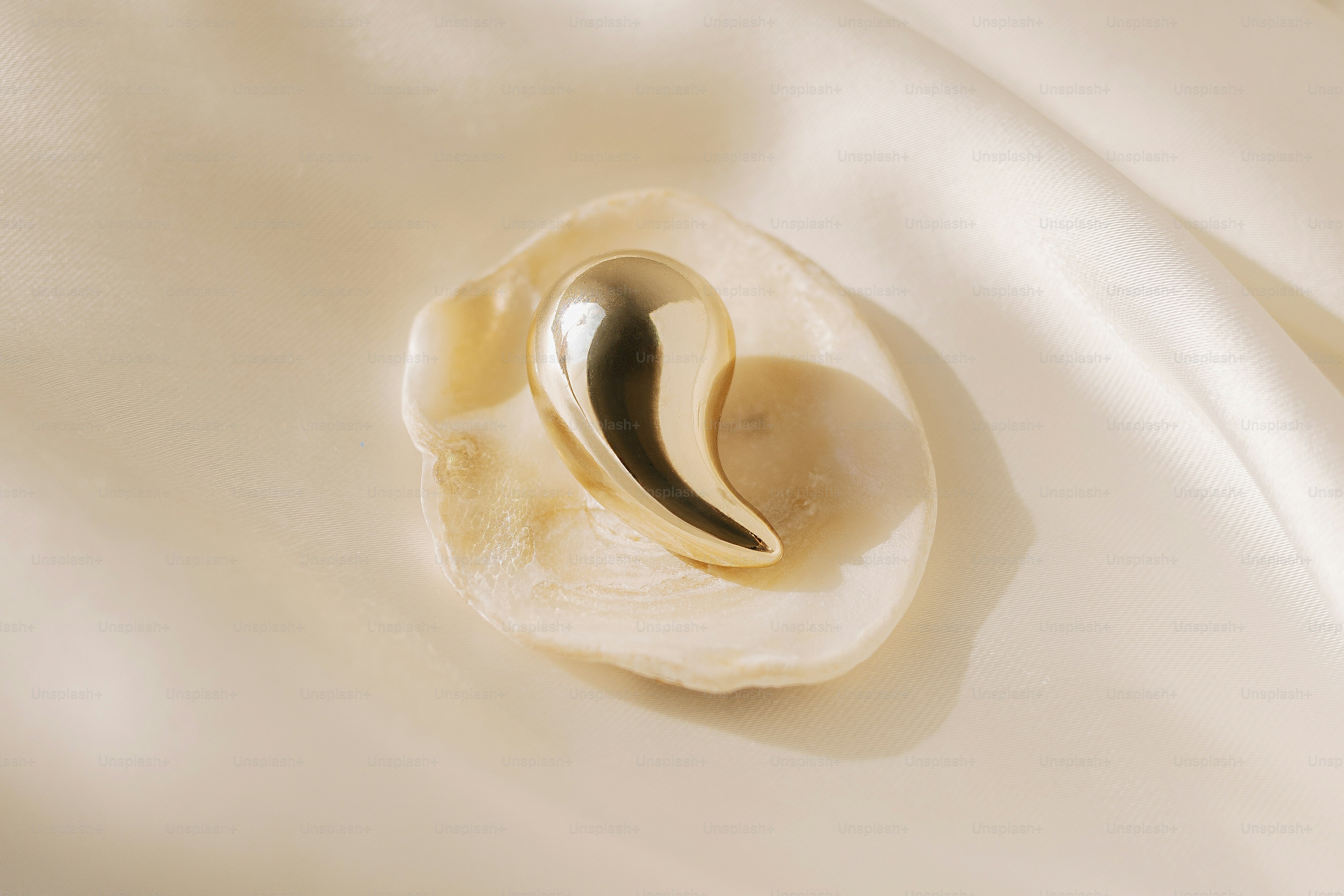 A close up of a white cloth with a metal object in the middle