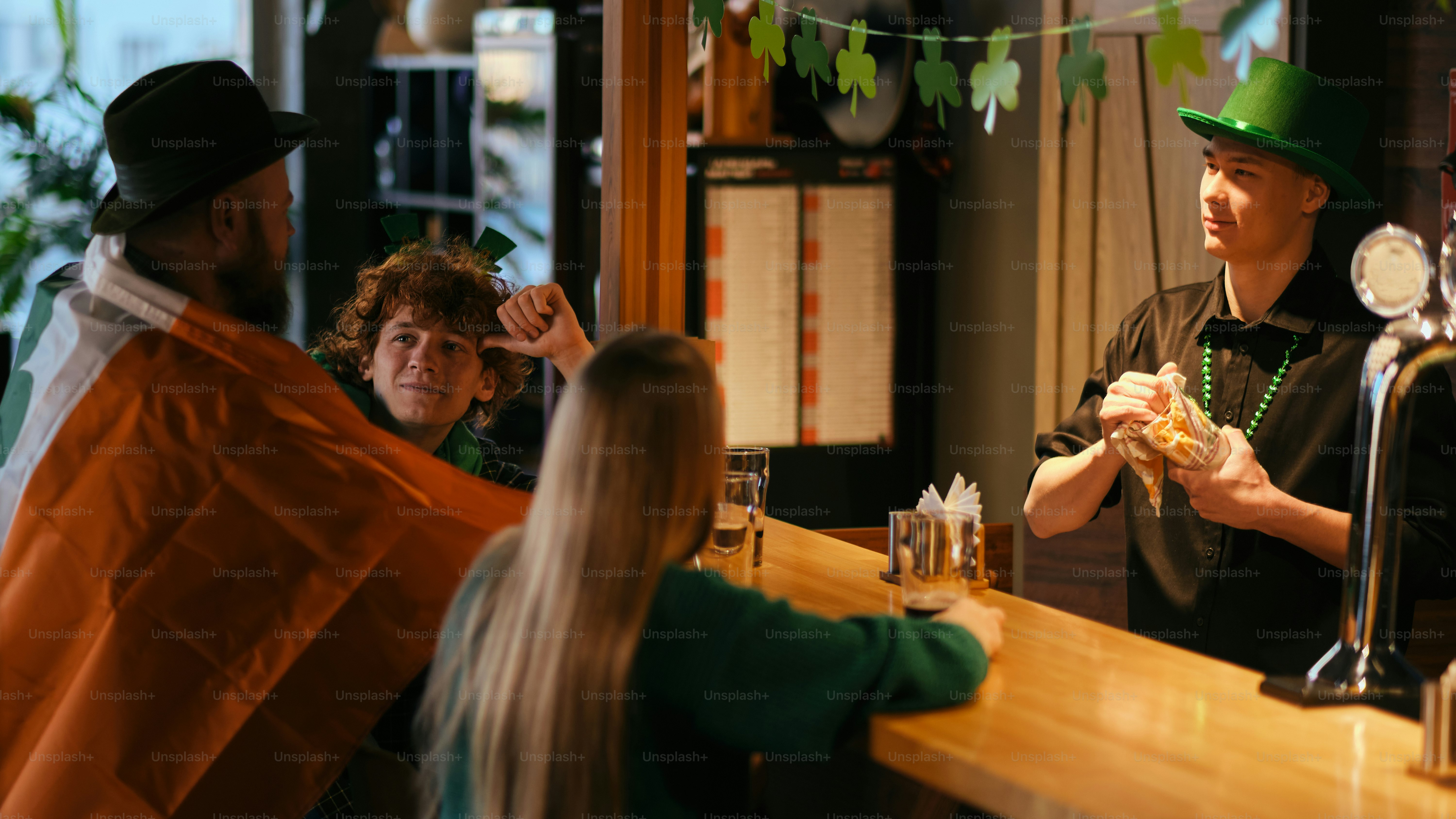A group of people sitting at a bar