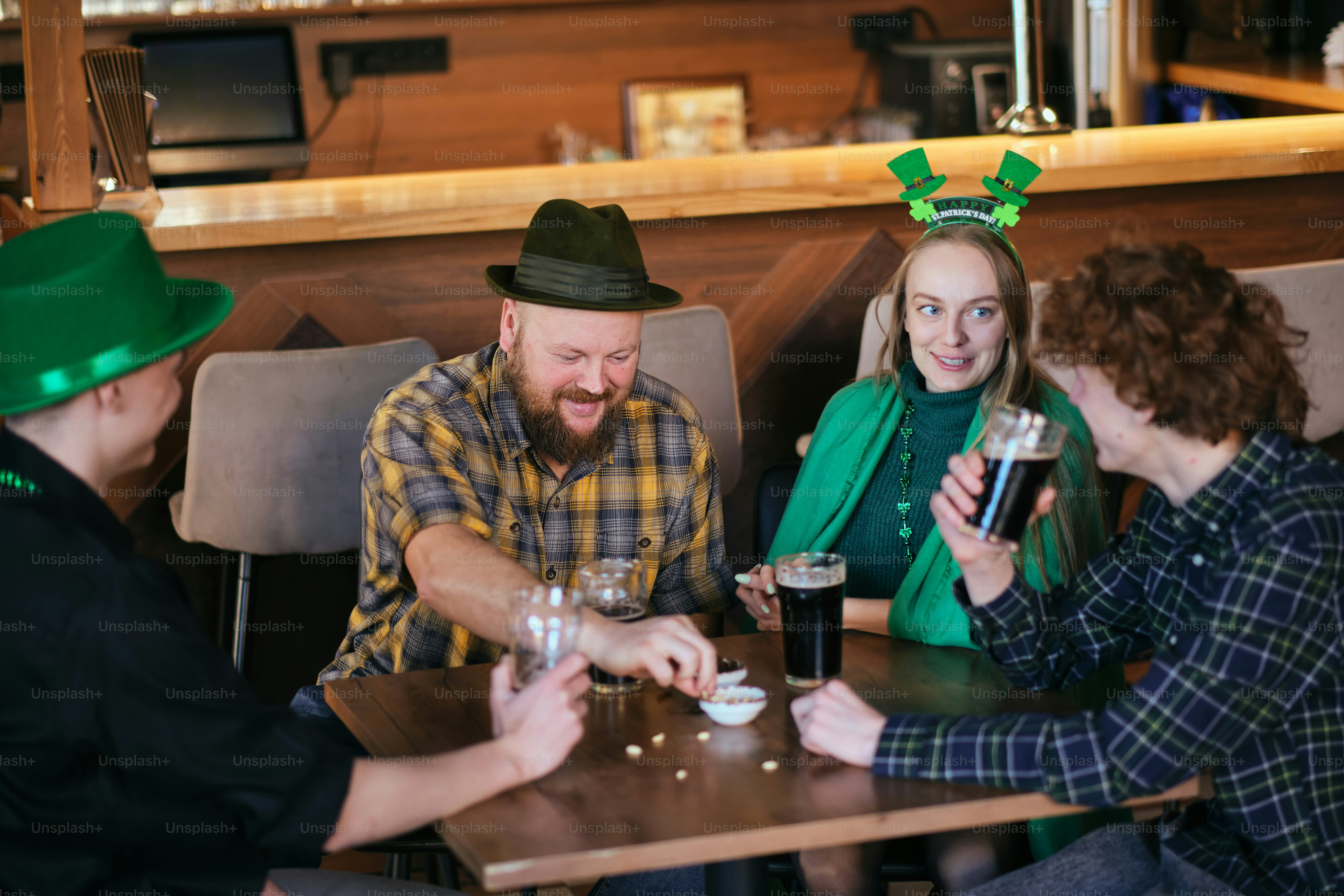 A group of people sitting around a wooden table