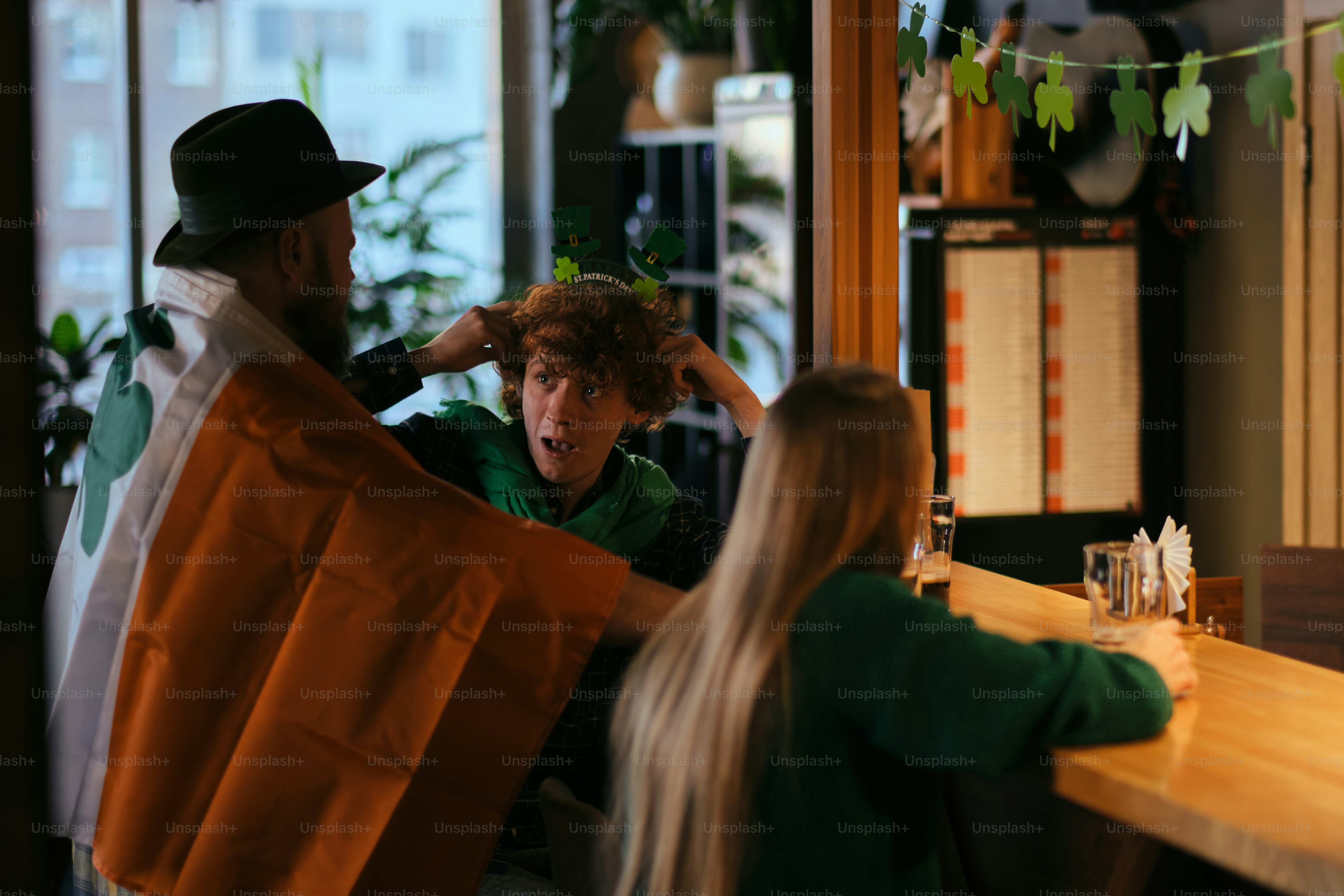 A man getting his hair cut at a barber shop