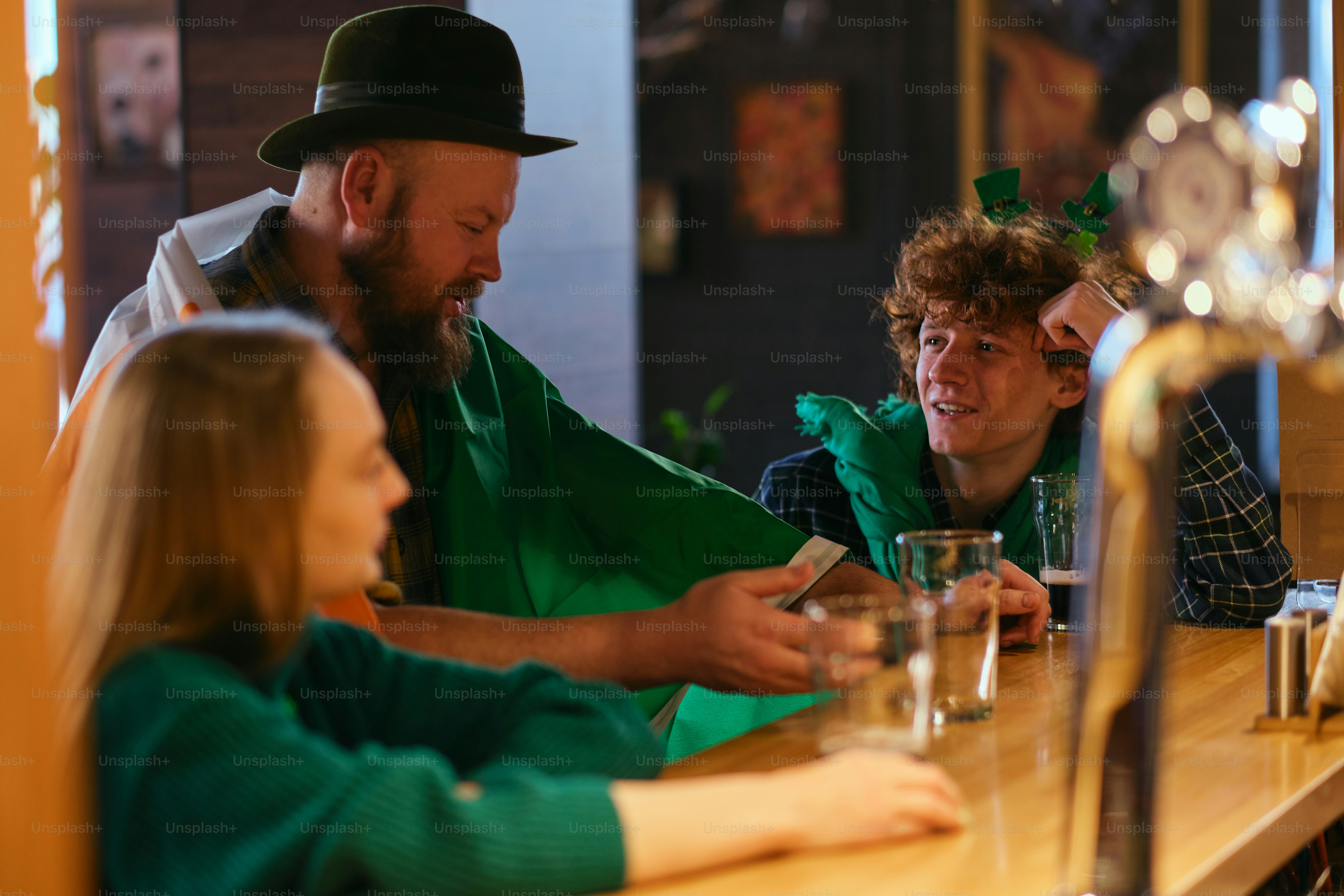 A group of people sitting at a bar