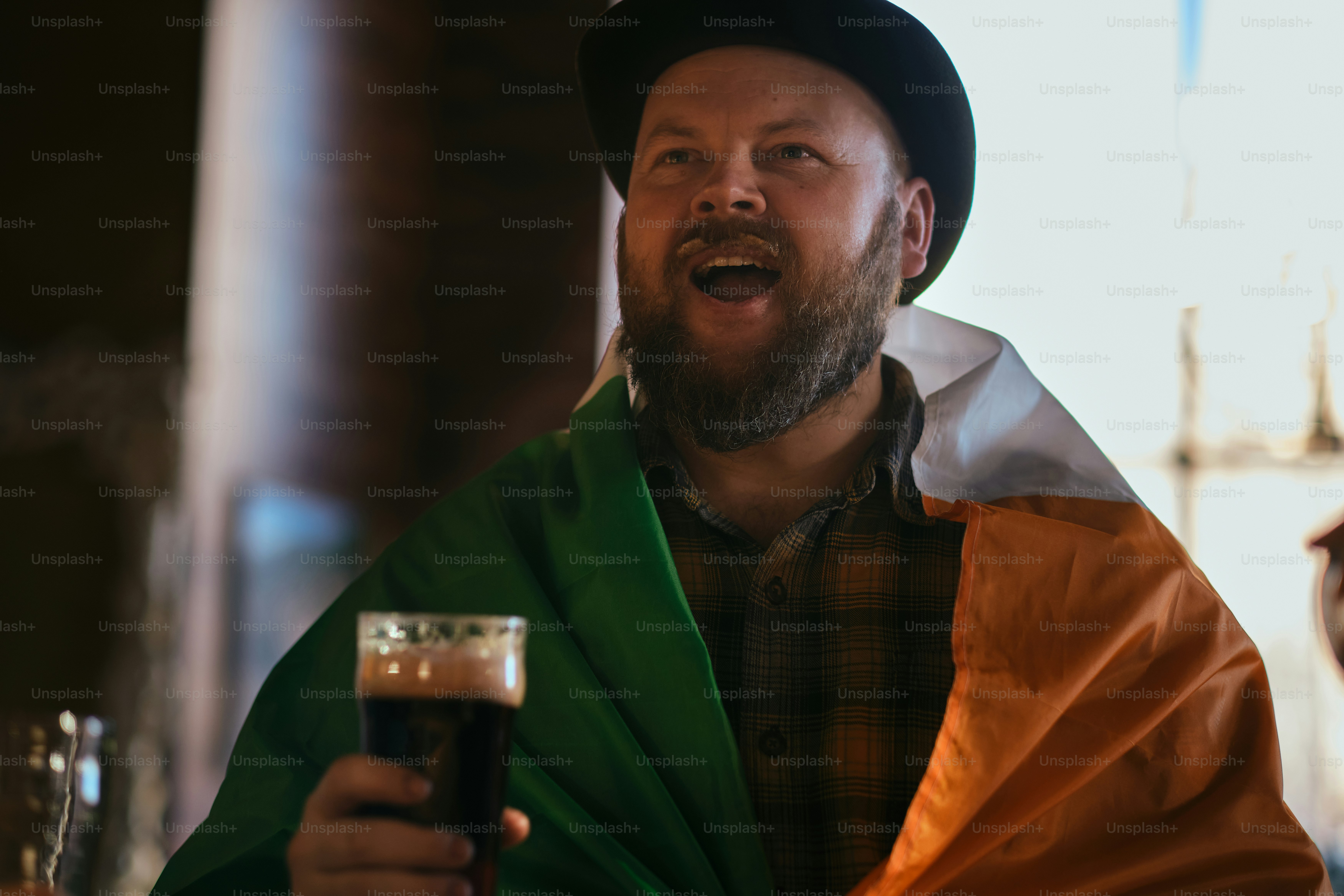 A man holding a beer in his hand