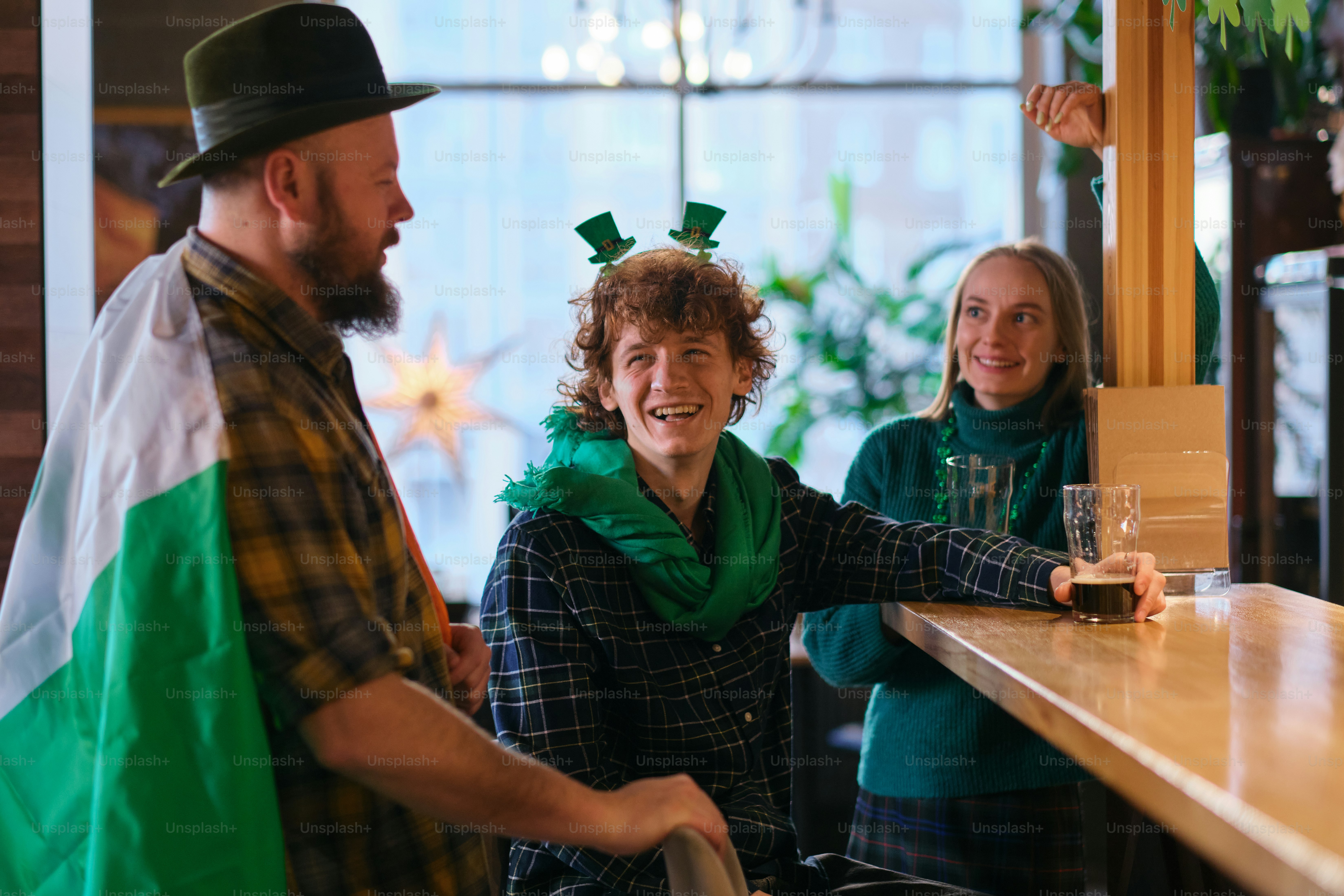 A group of people standing around a bar