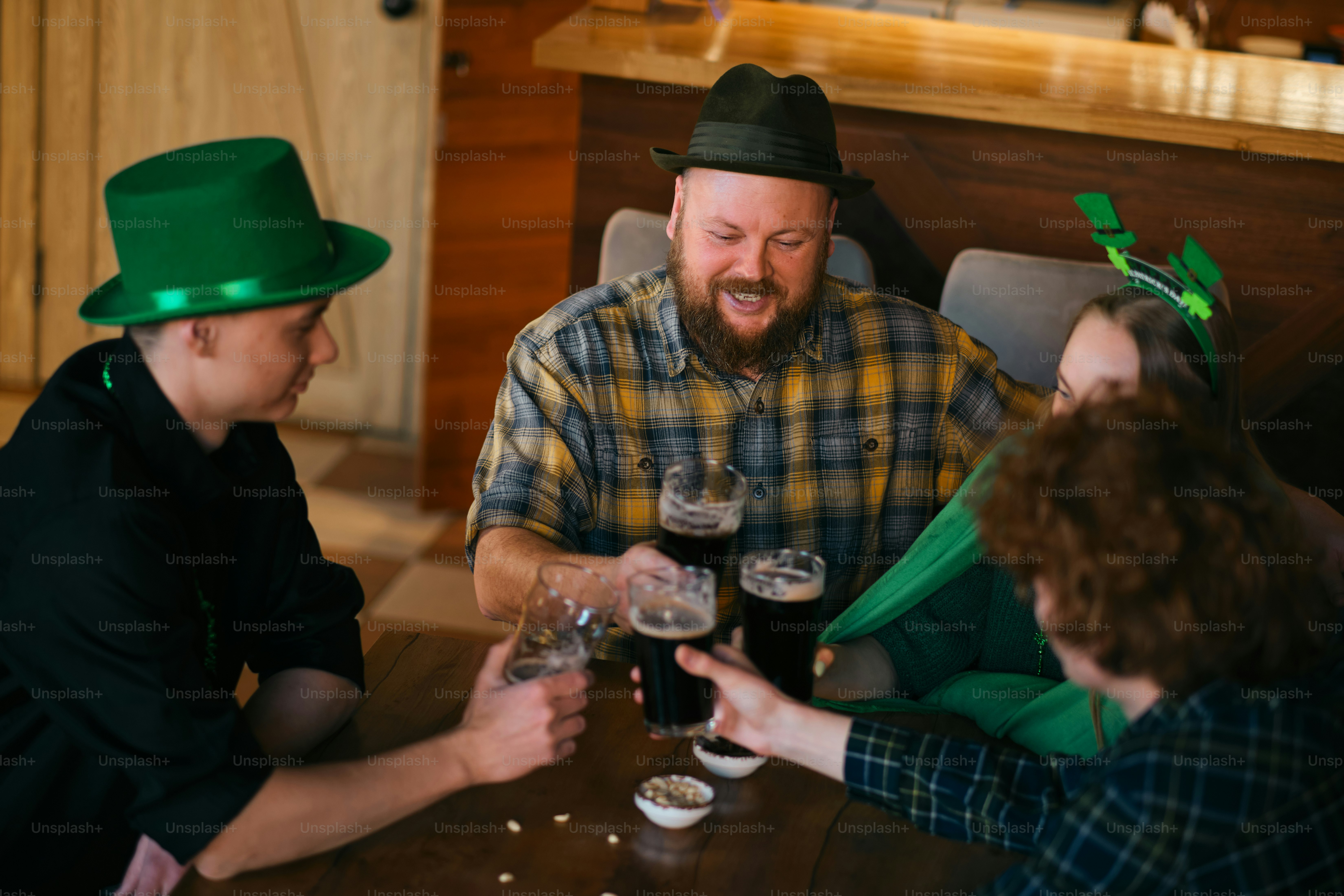 A group of people sitting around a table with wine glasses