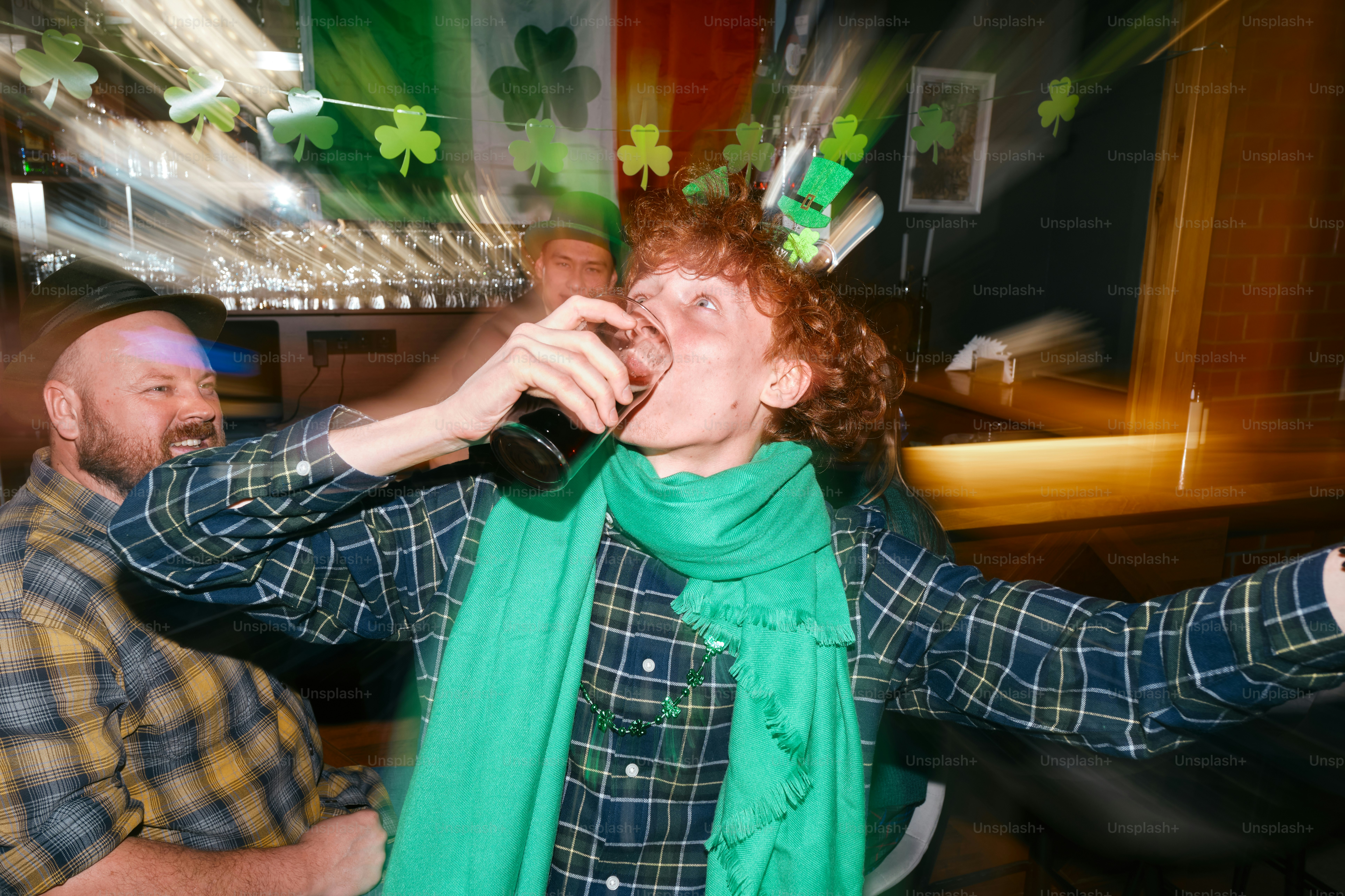 A woman wearing a green scarf and a green scarf around her neck