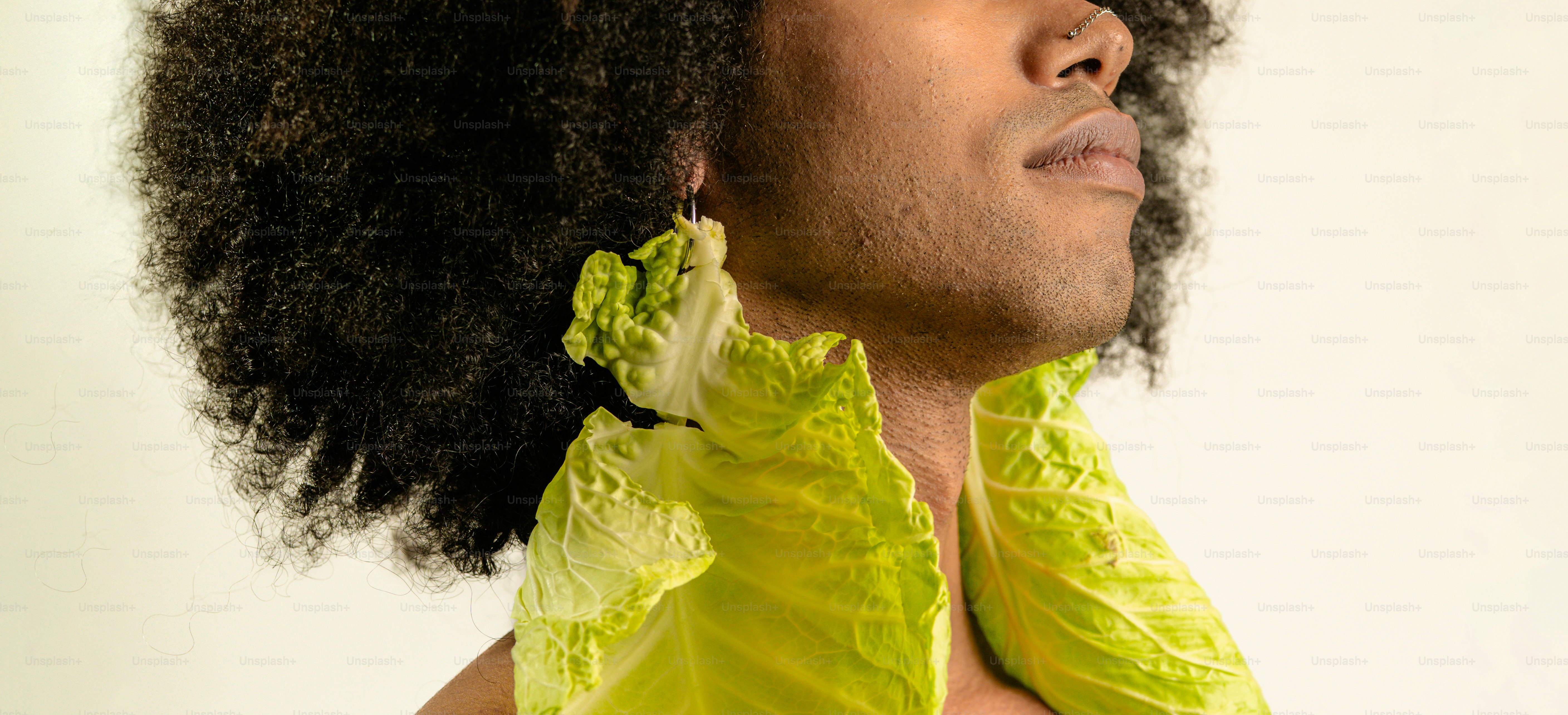 A close up of a person with an afro