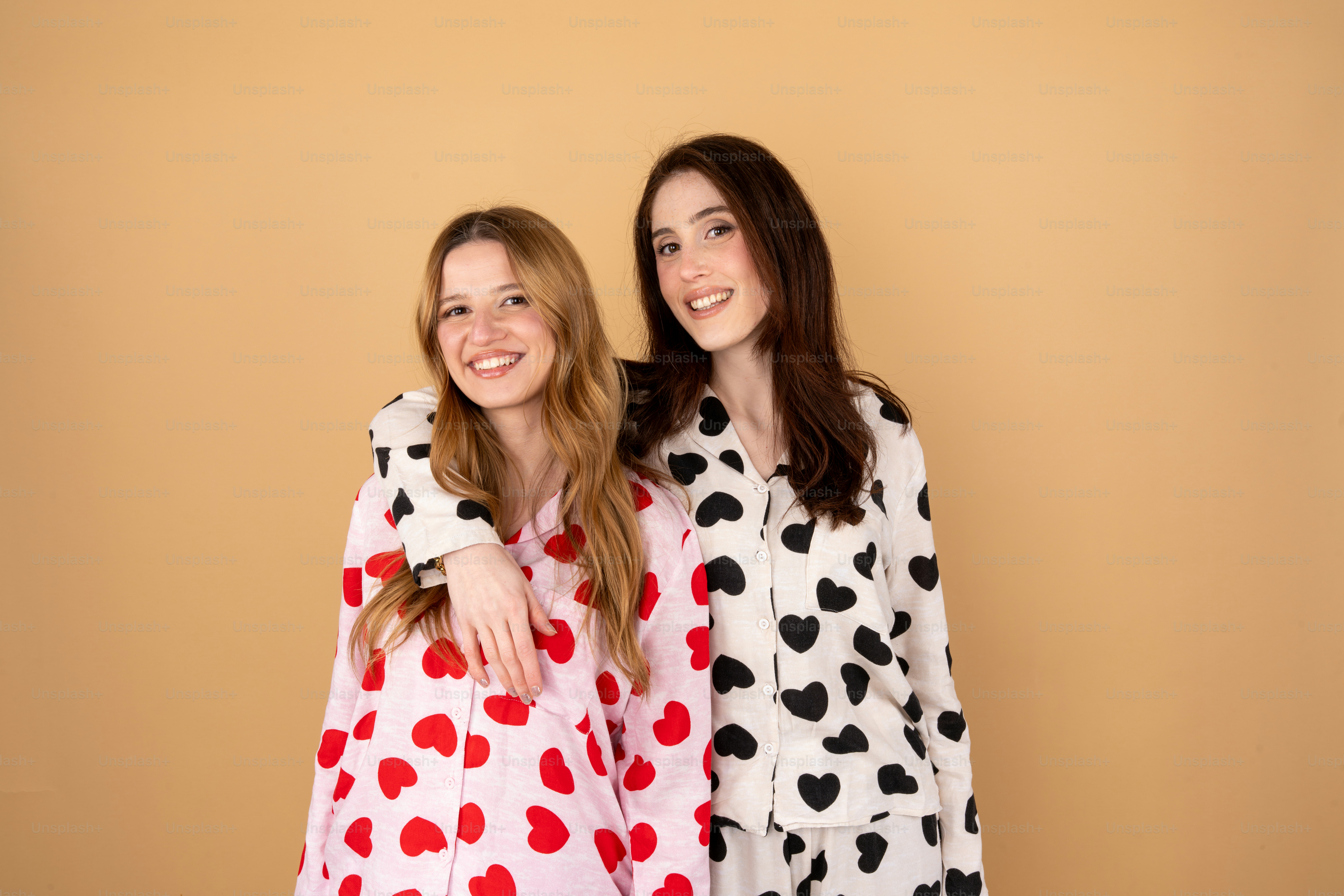 Two women dressed in costumes posing for a picture