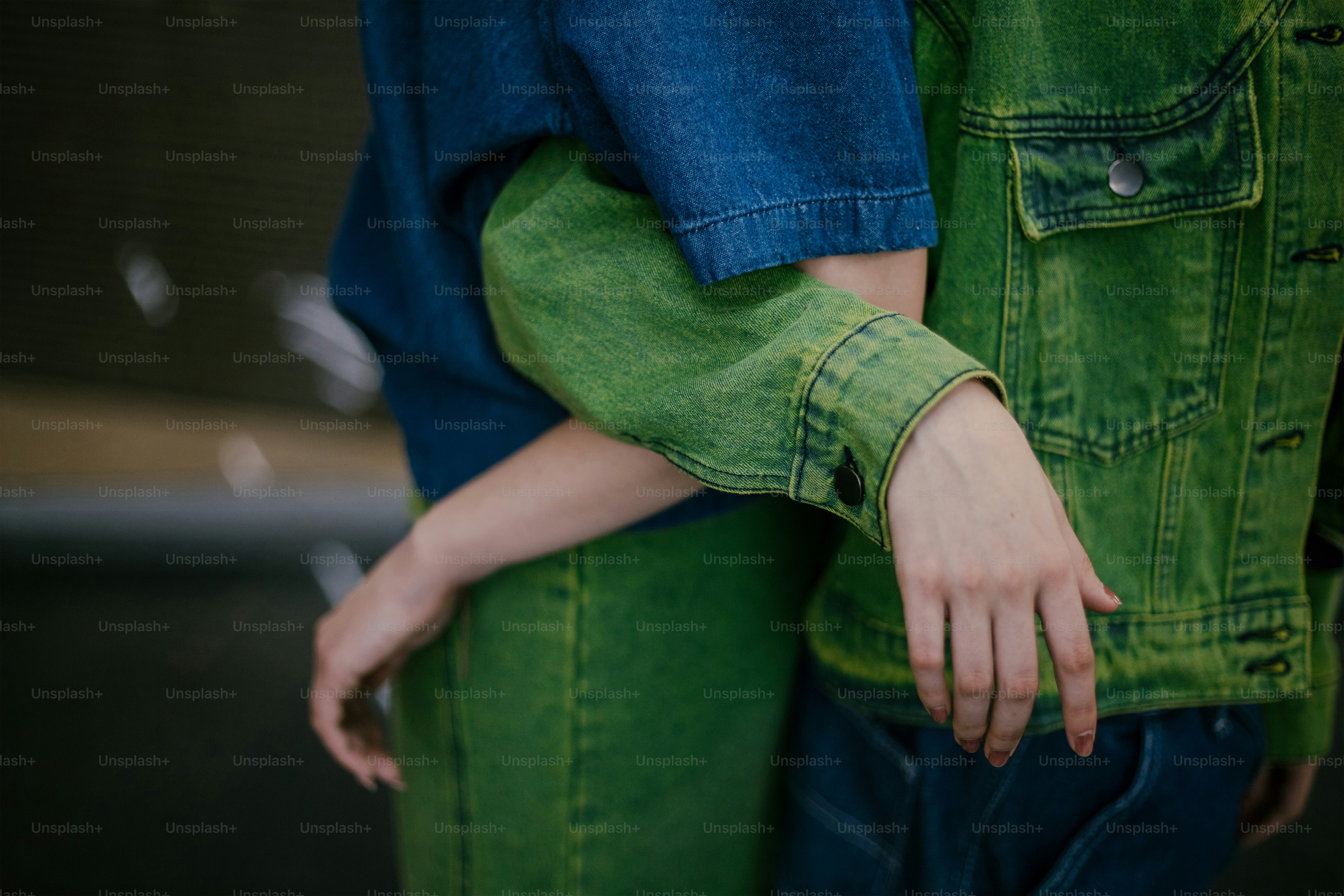 A close up of two people hugging each other