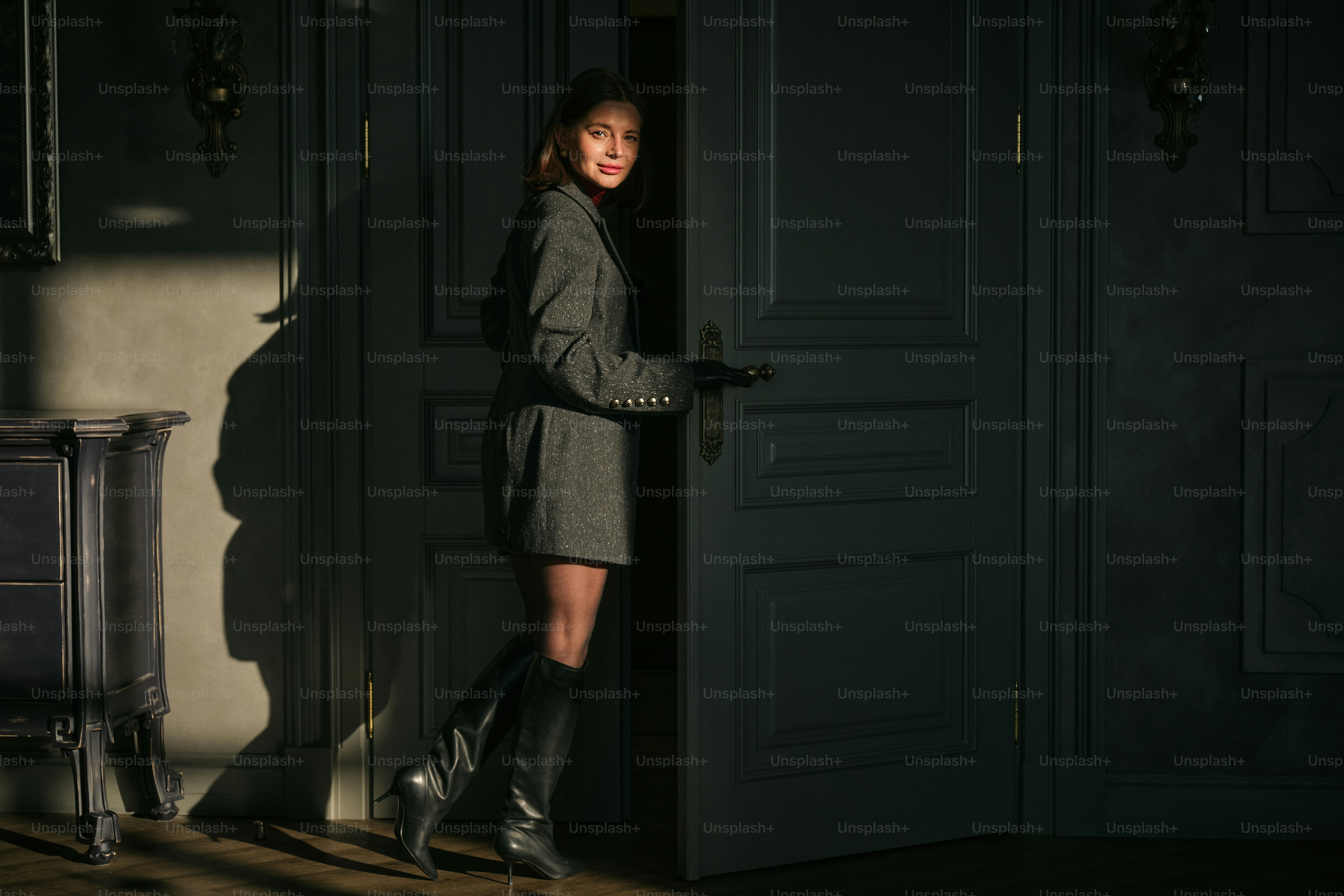A woman standing in front of a door photo – Classic Image on Unsplash