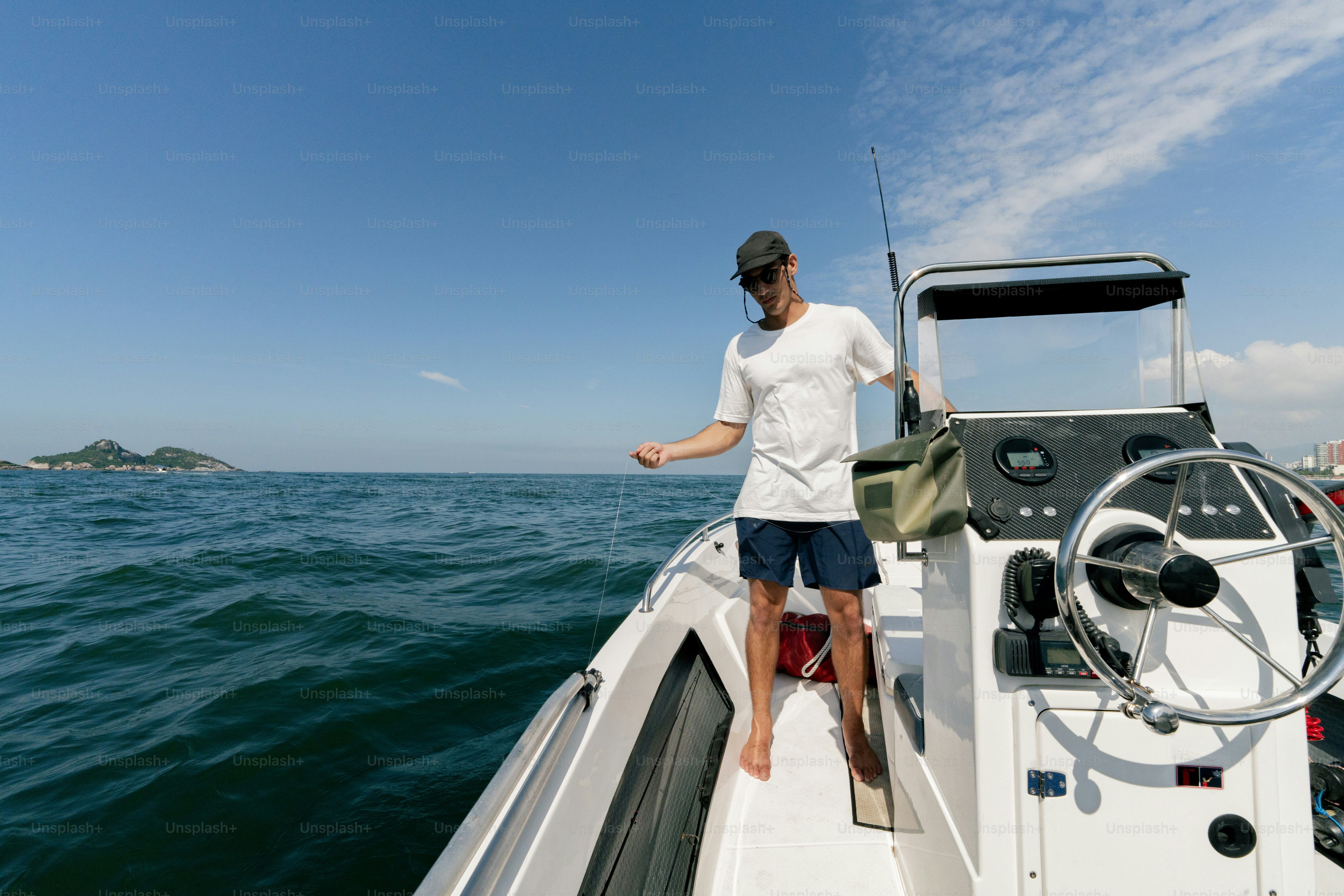 A man standing on the bow of a boat