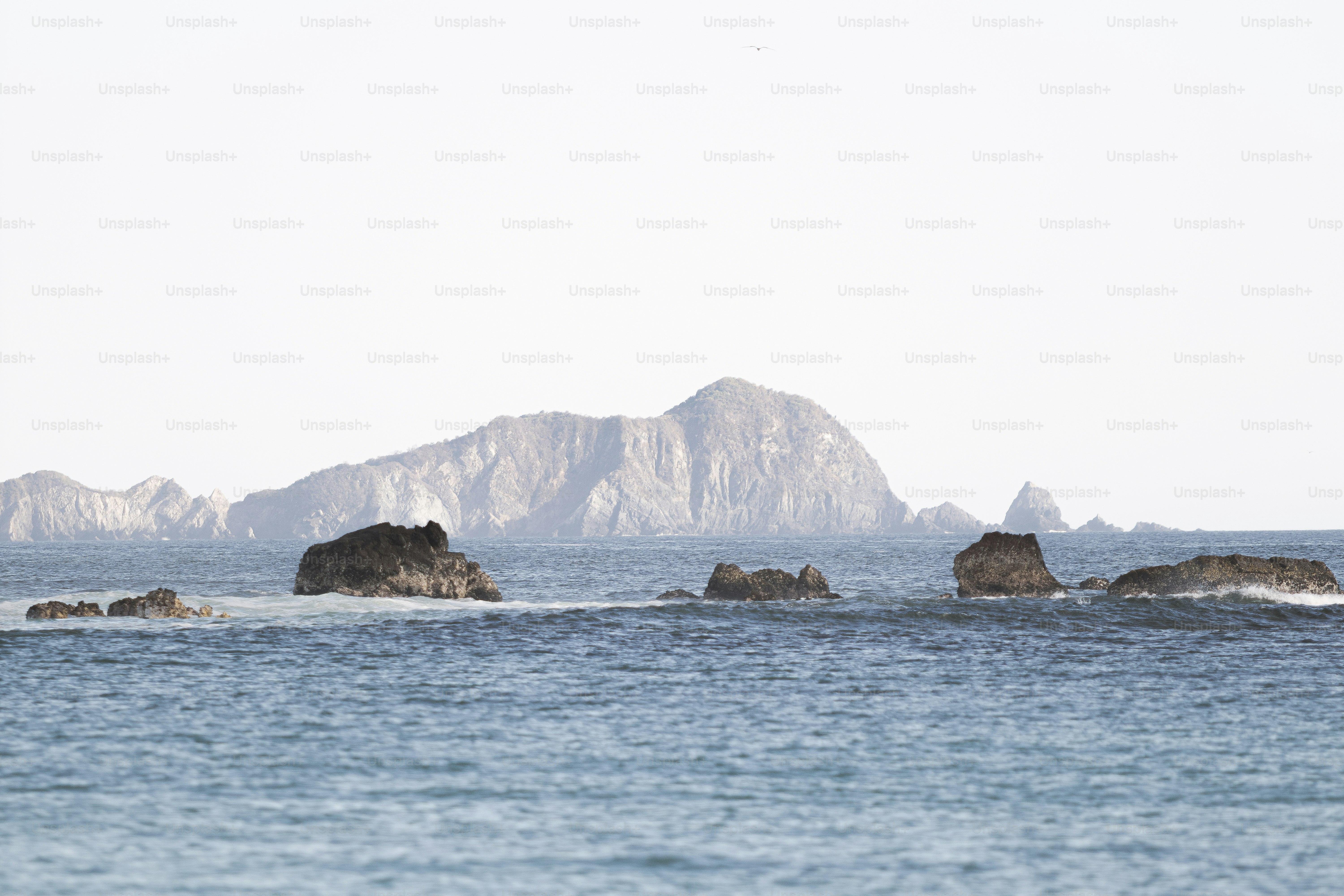 A large body of water with mountains in the background