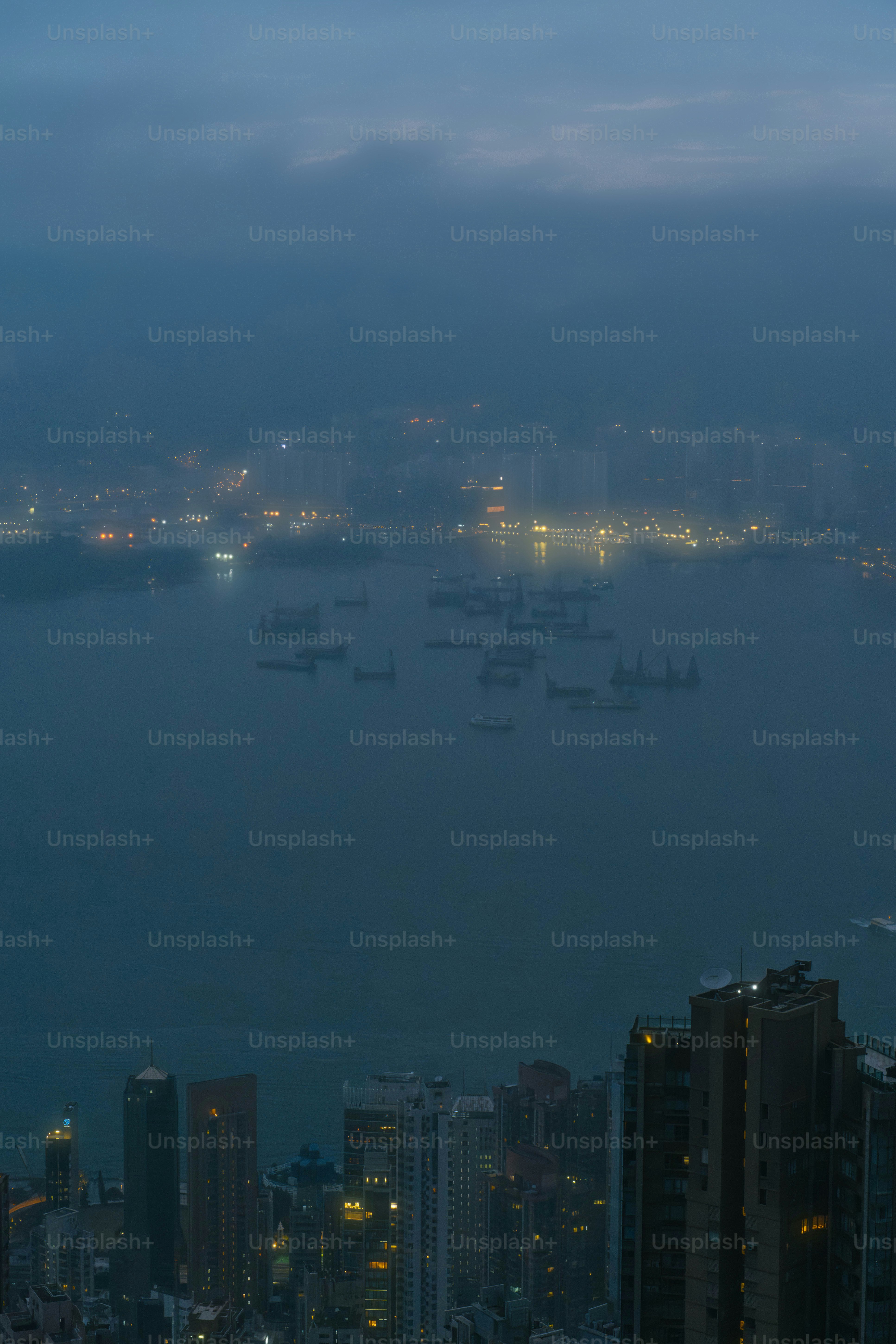 A large body of water surrounded by tall buildings
