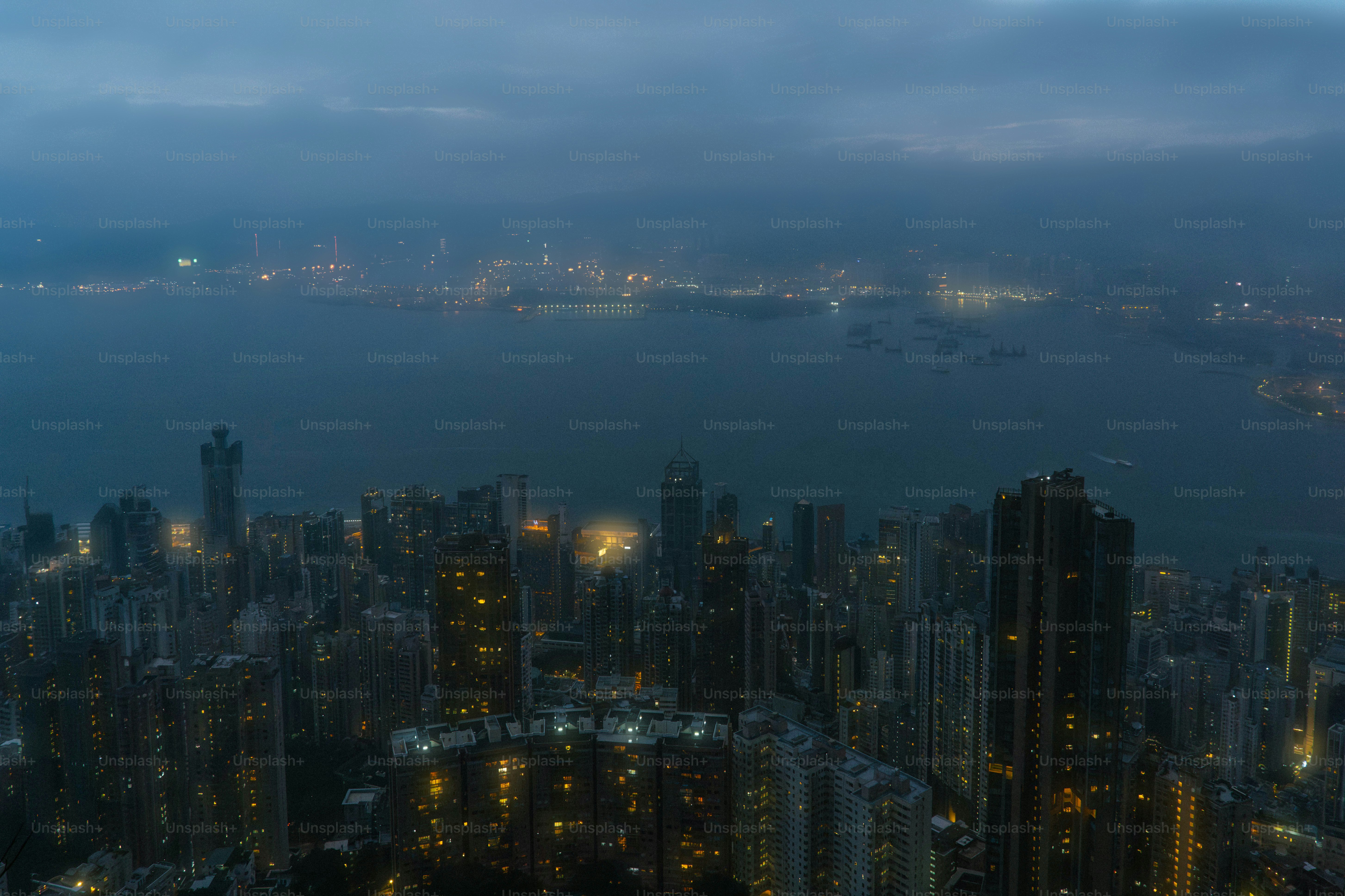 A view of a city at night from the top of a building