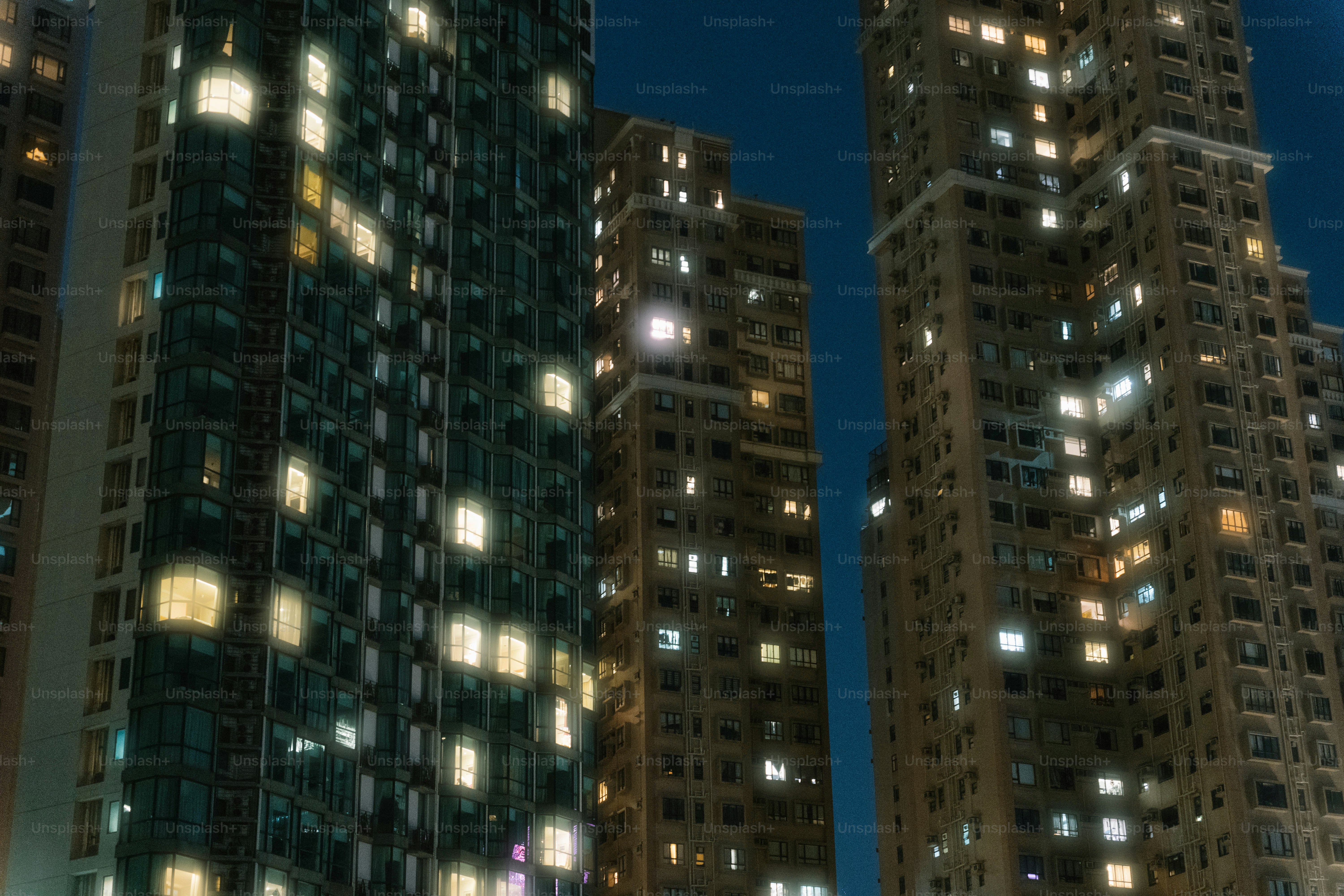 A city at night with a full moon in the sky
