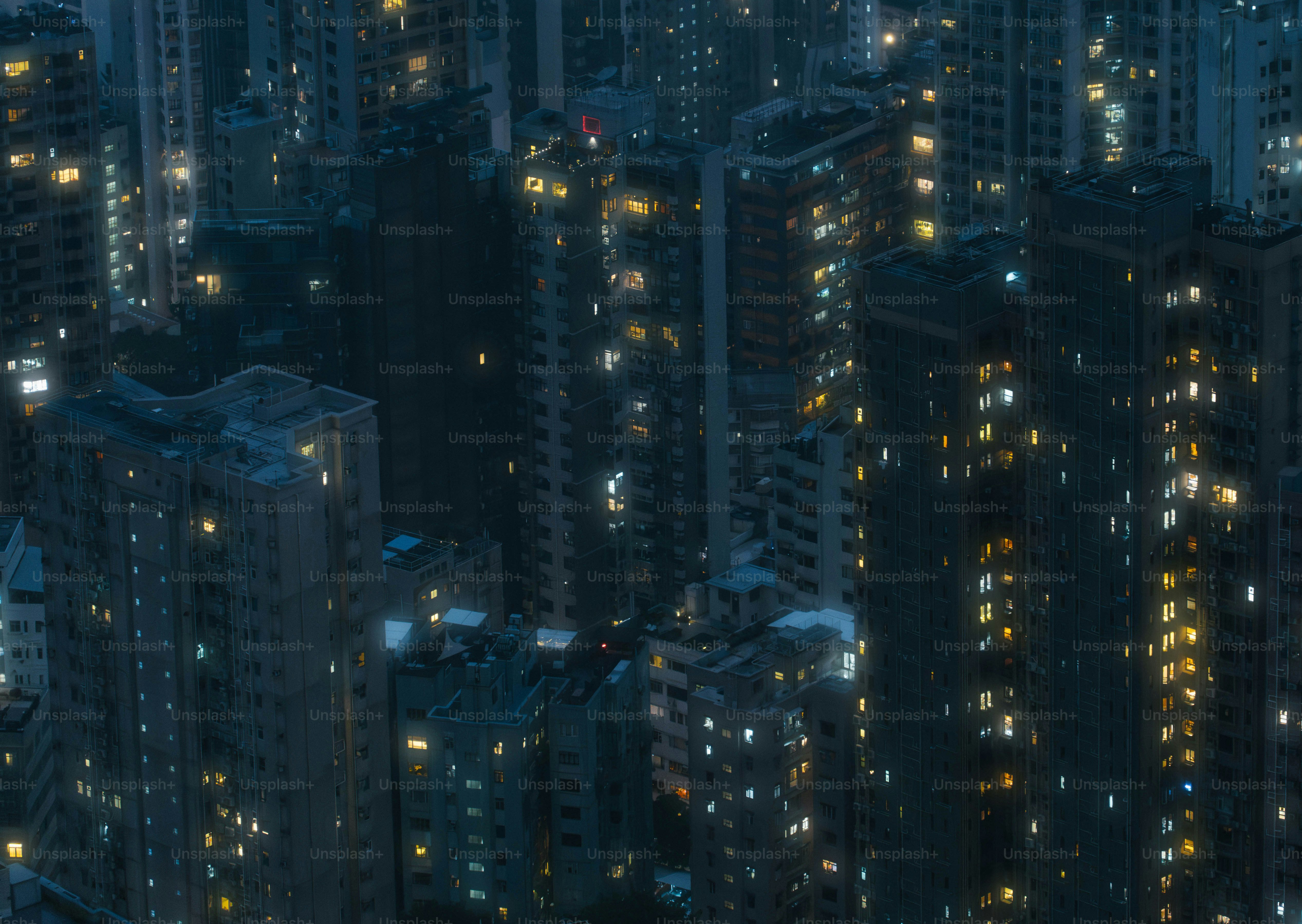 A city at night with lots of tall buildings photo – City Image on Unsplash