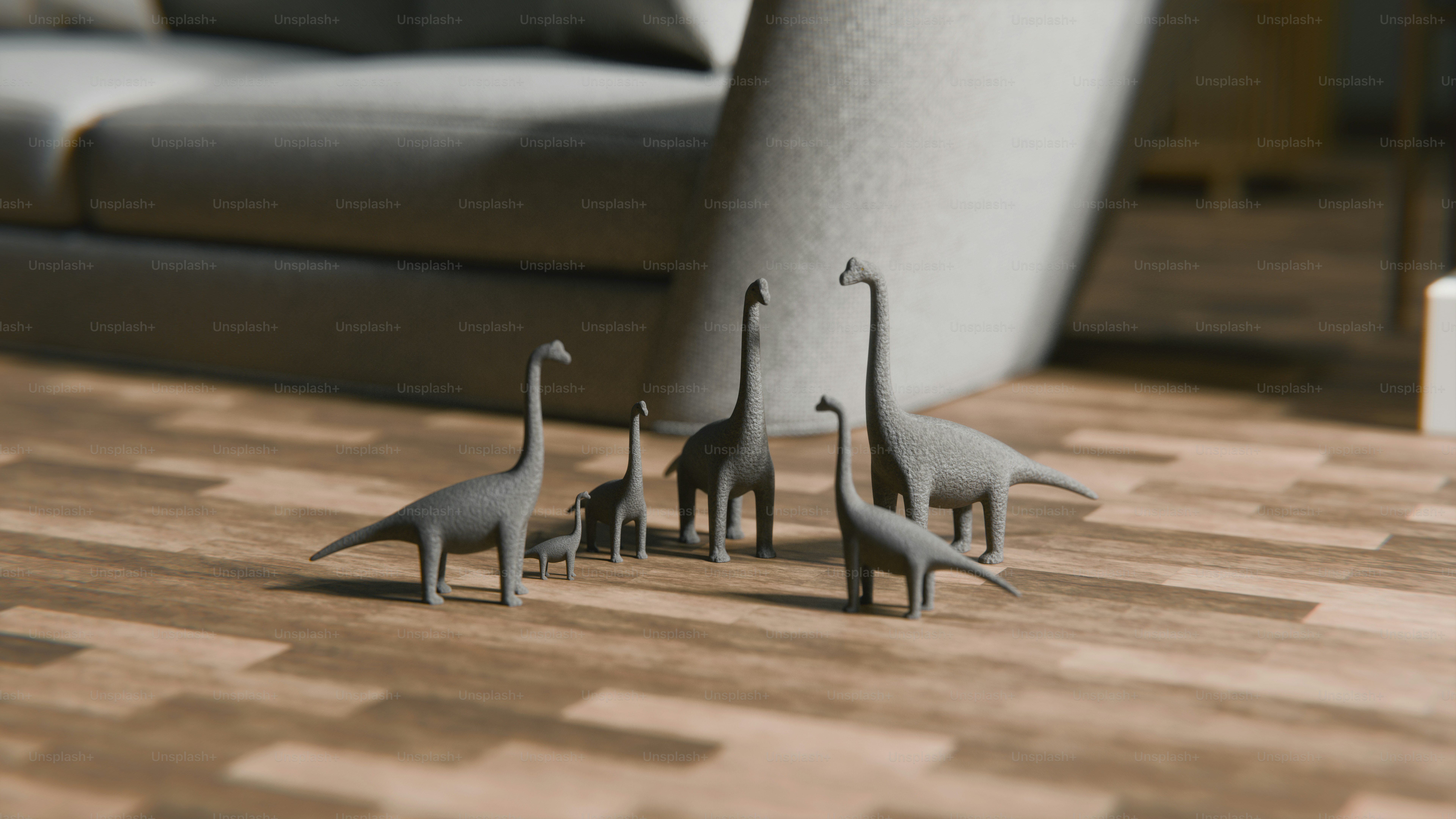 Tiny dinosaur figurines gather on a wooden floor.