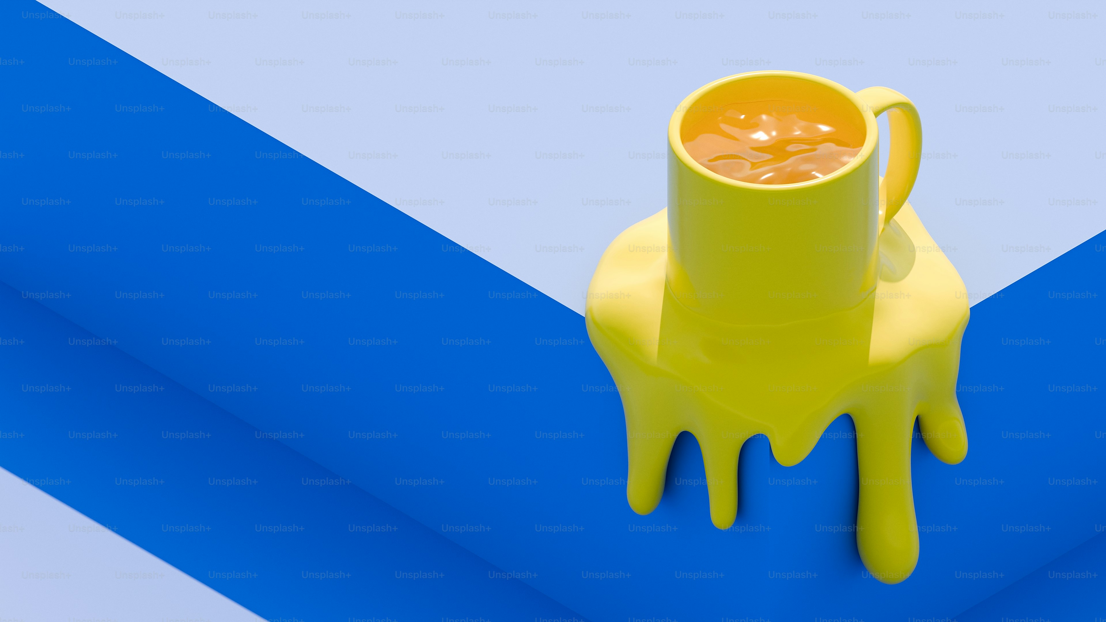 A yellow cup sitting on top of a blue and white table