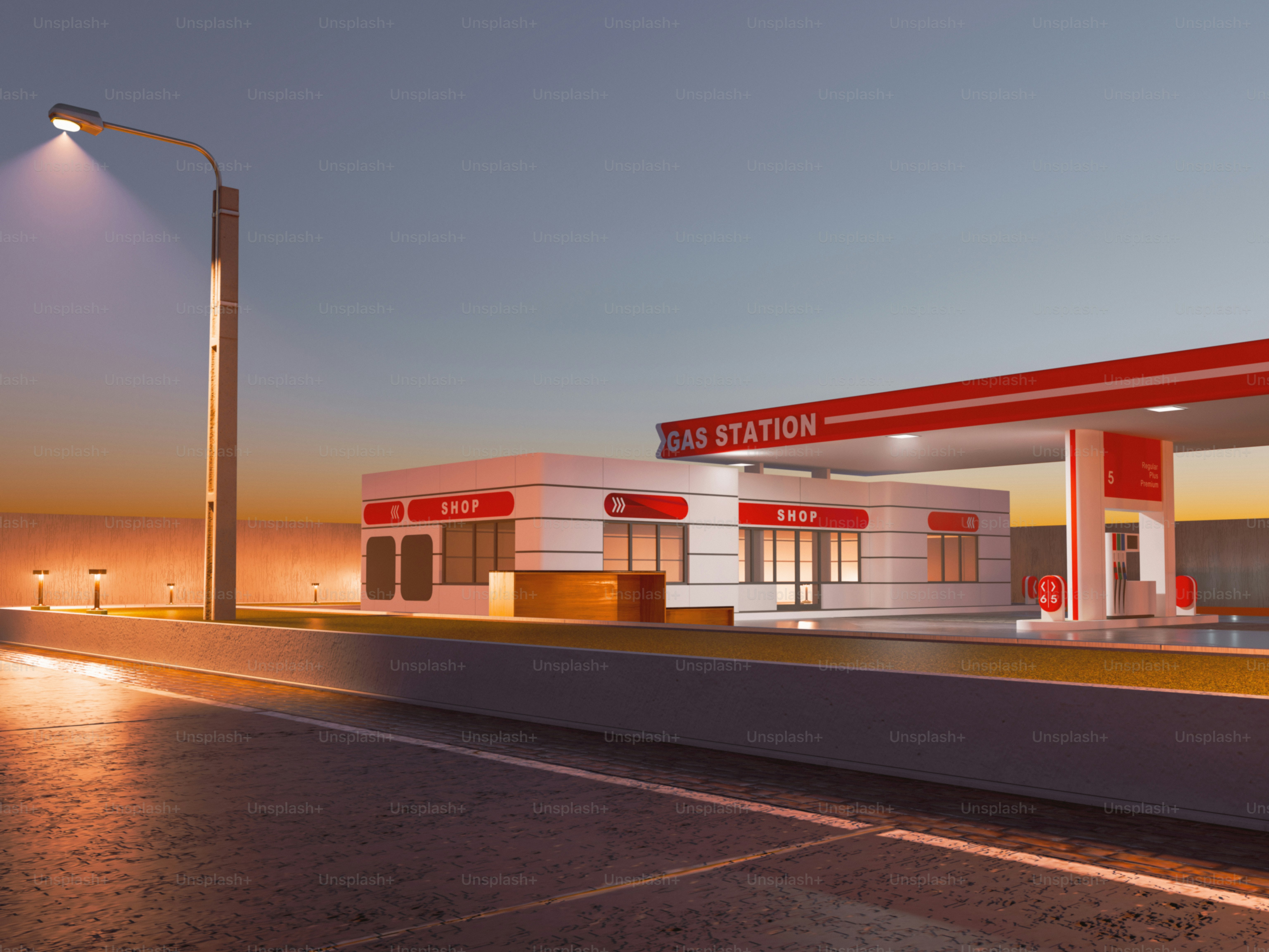 A gas station sits at dusk under the streetlights.