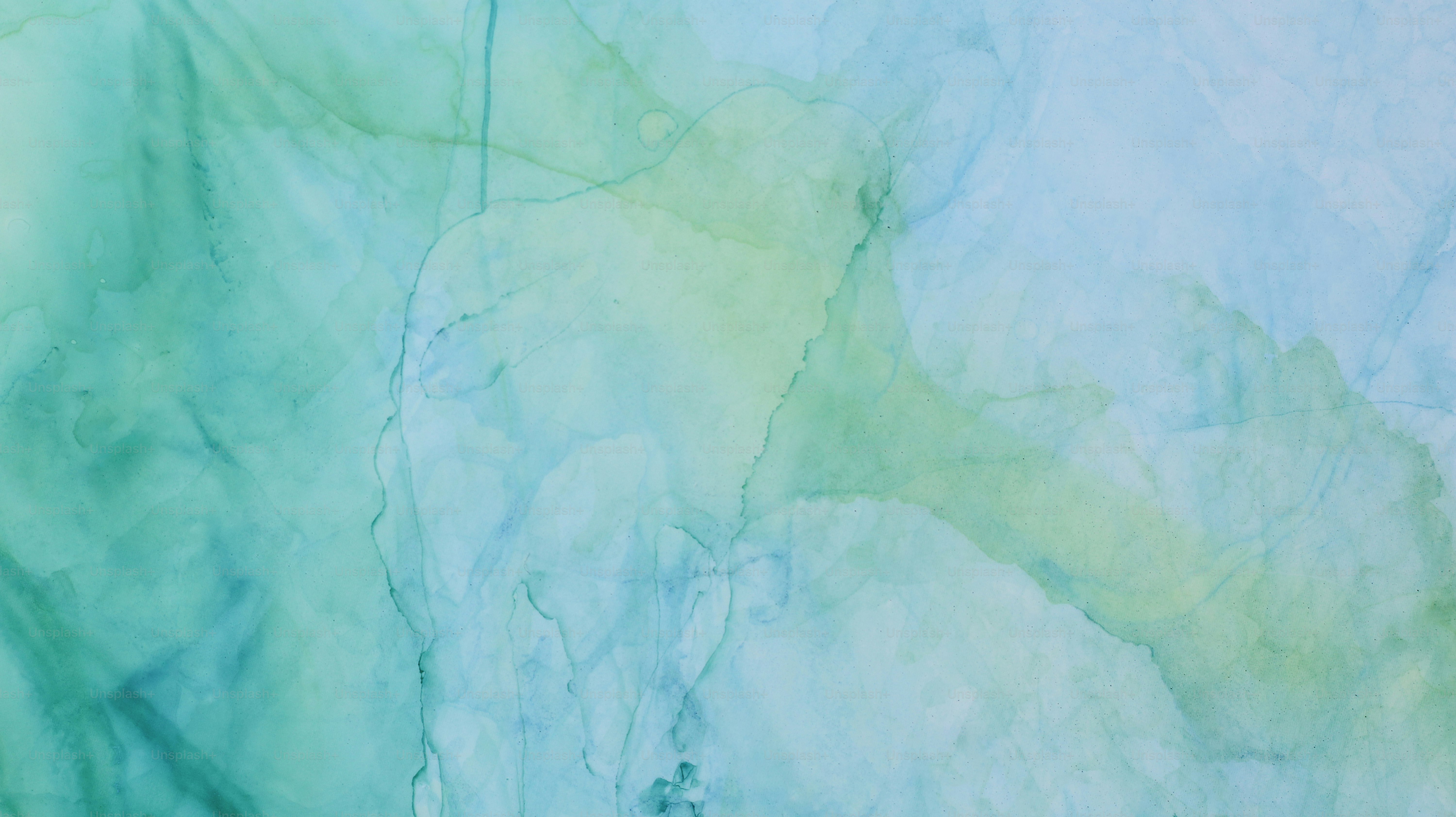 Abstract watercolor painting in shades of blue and green