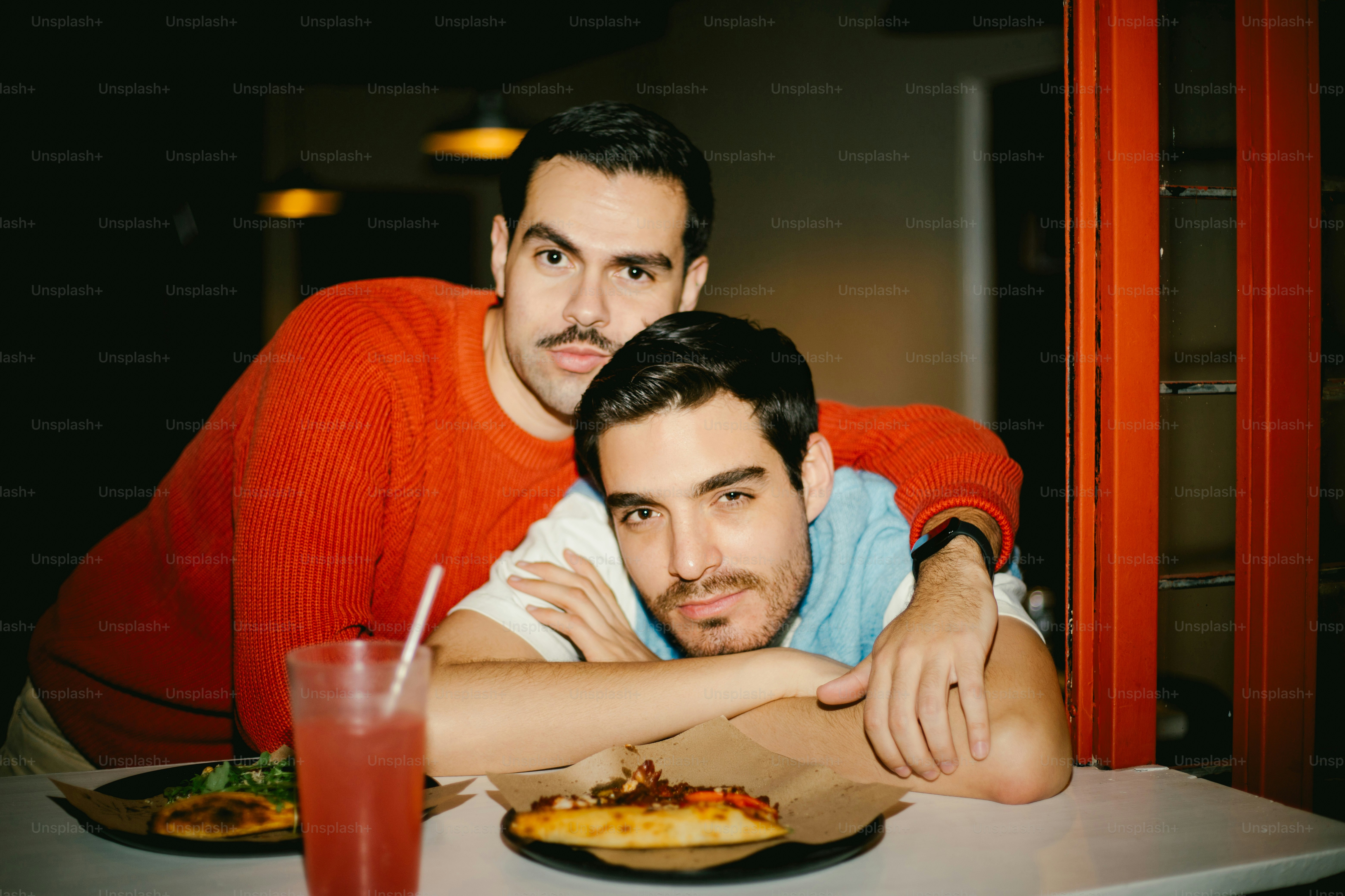 Two men are playfully interacting and laughing. photo – Love Image on ...