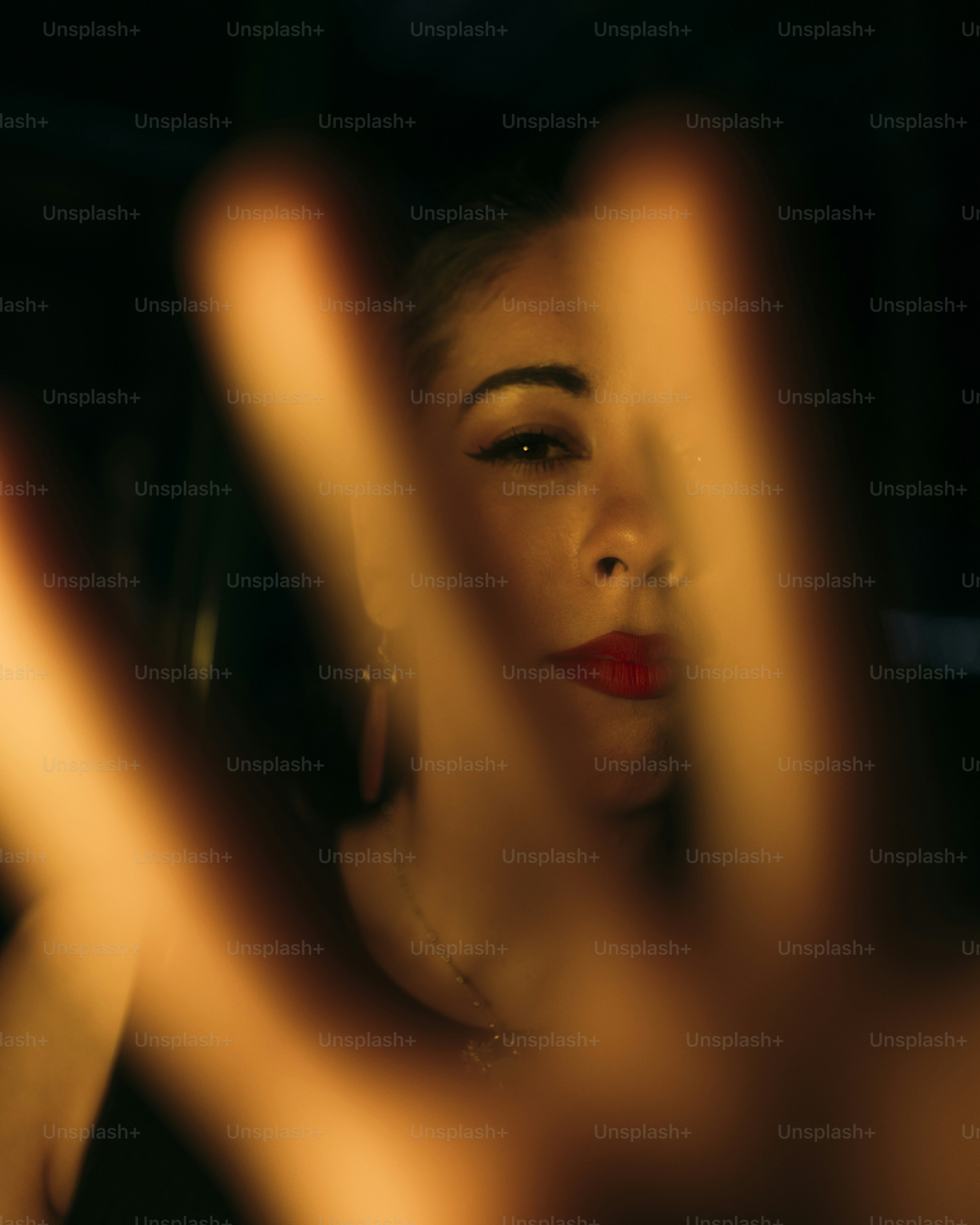 A faint face emerges from darkness. photo – Portrait Image on Unsplash