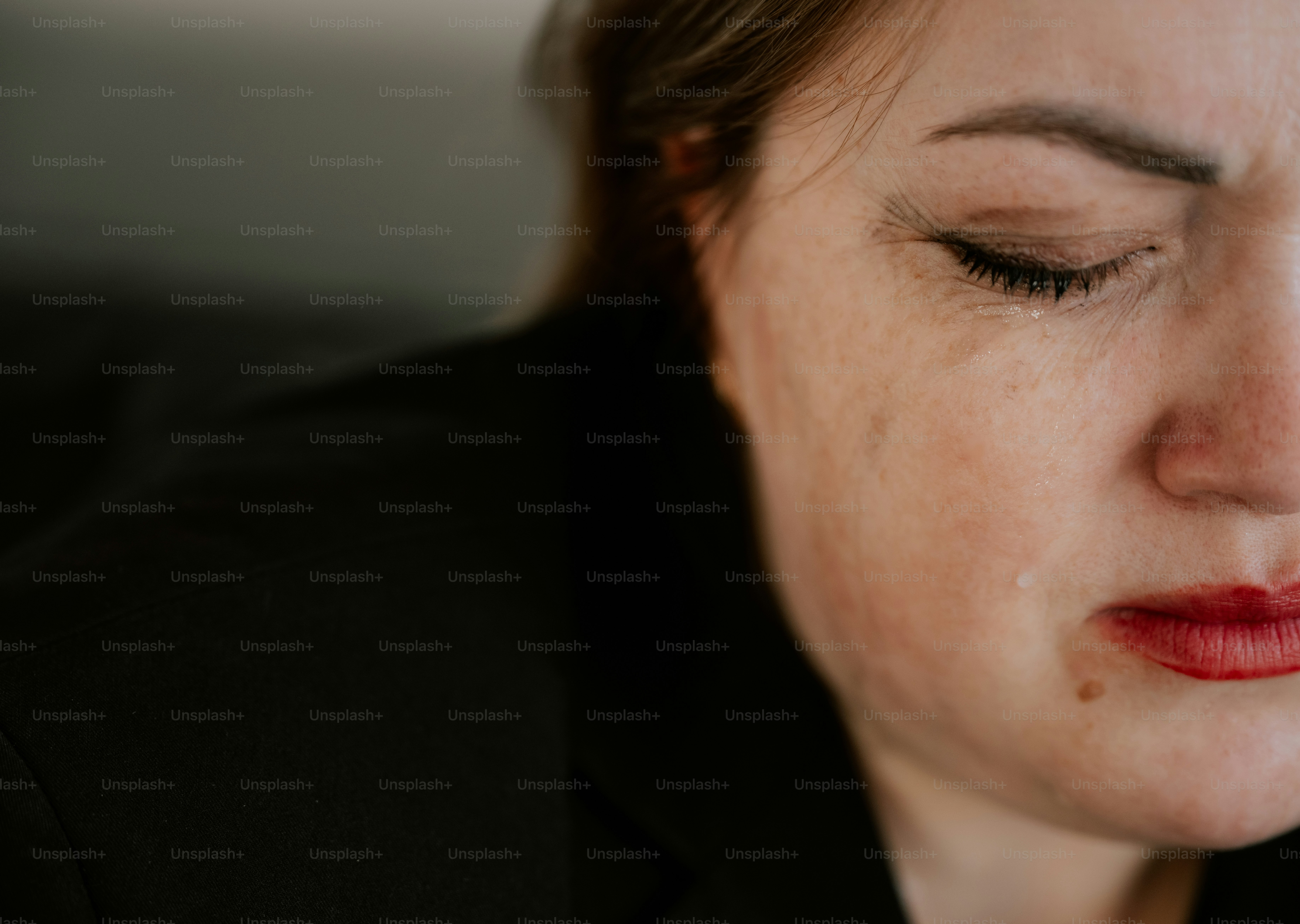 A woman appears to be crying.