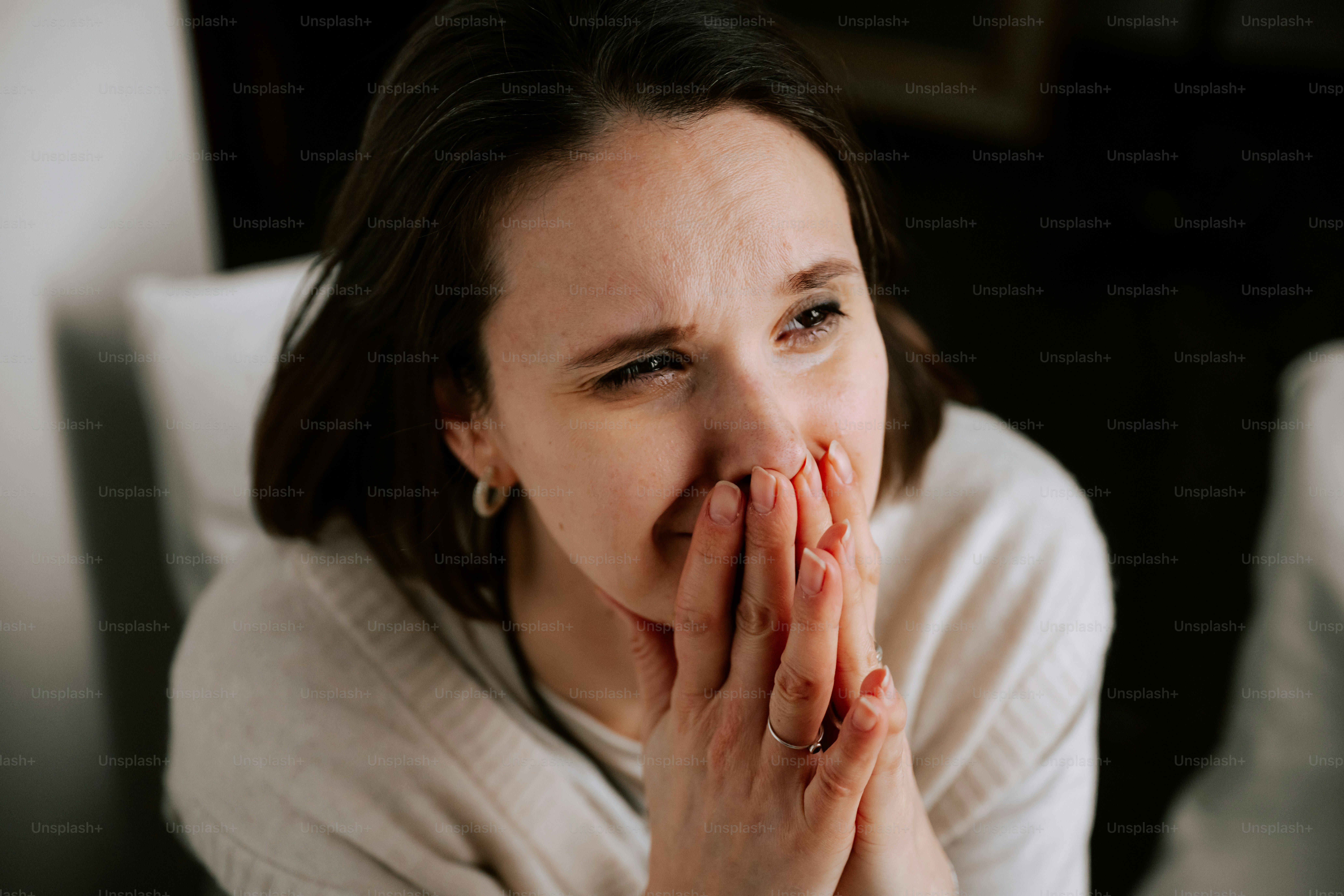 A woman appears sad or overwhelmed.