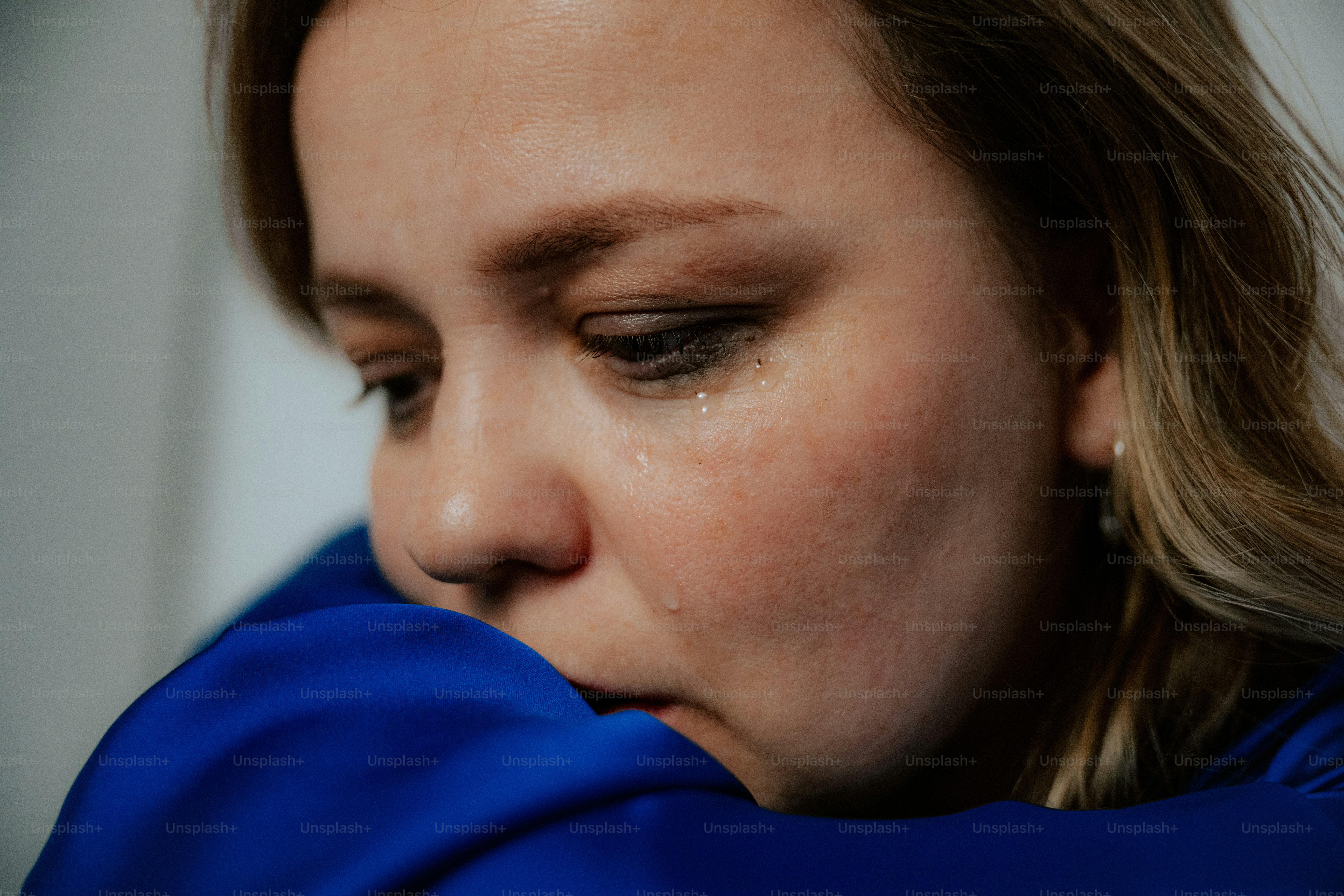 A woman is visibly crying, overcome with emotion.