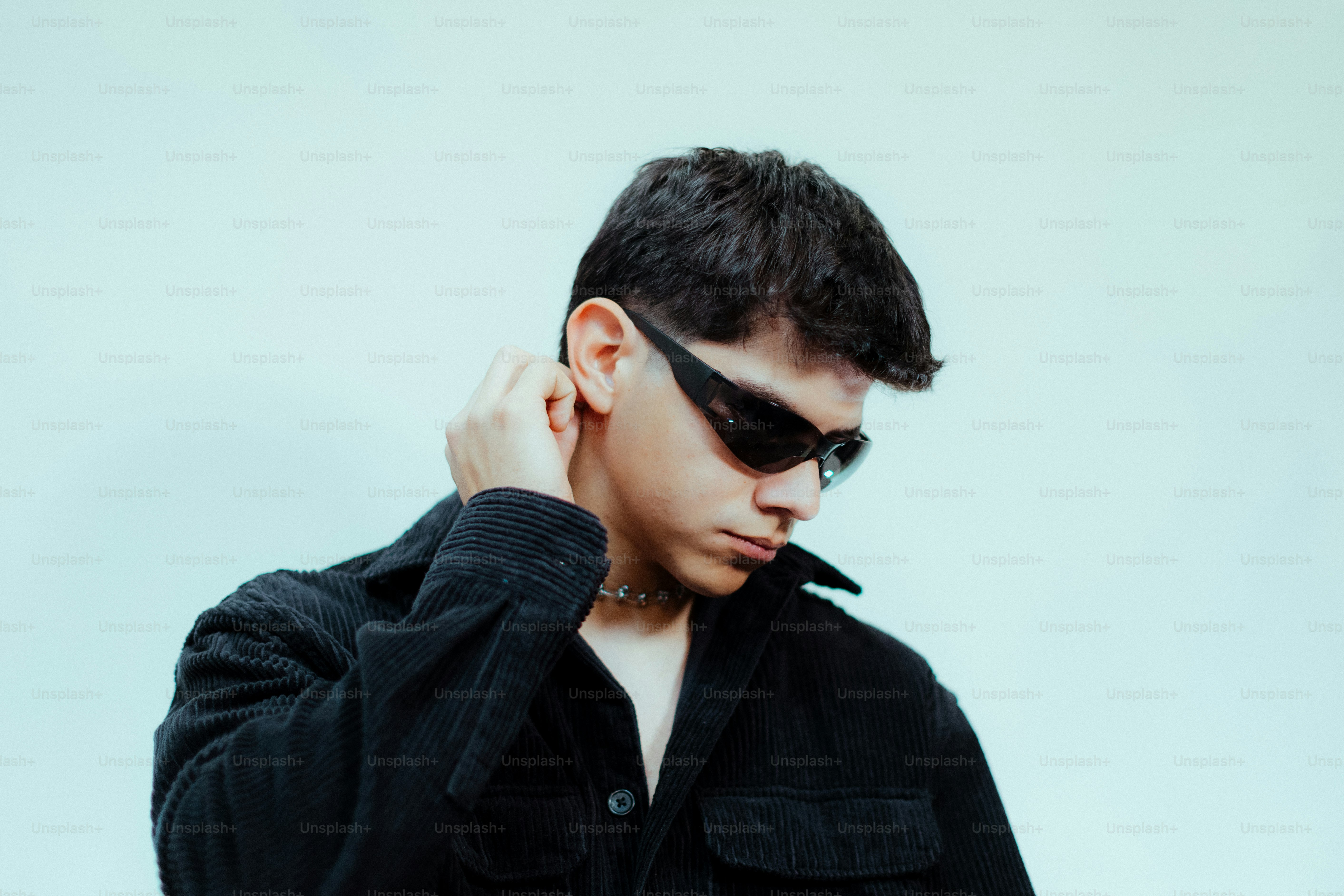 Young man poses in a black shirt and sunglasses. photo – Haircut Image ...