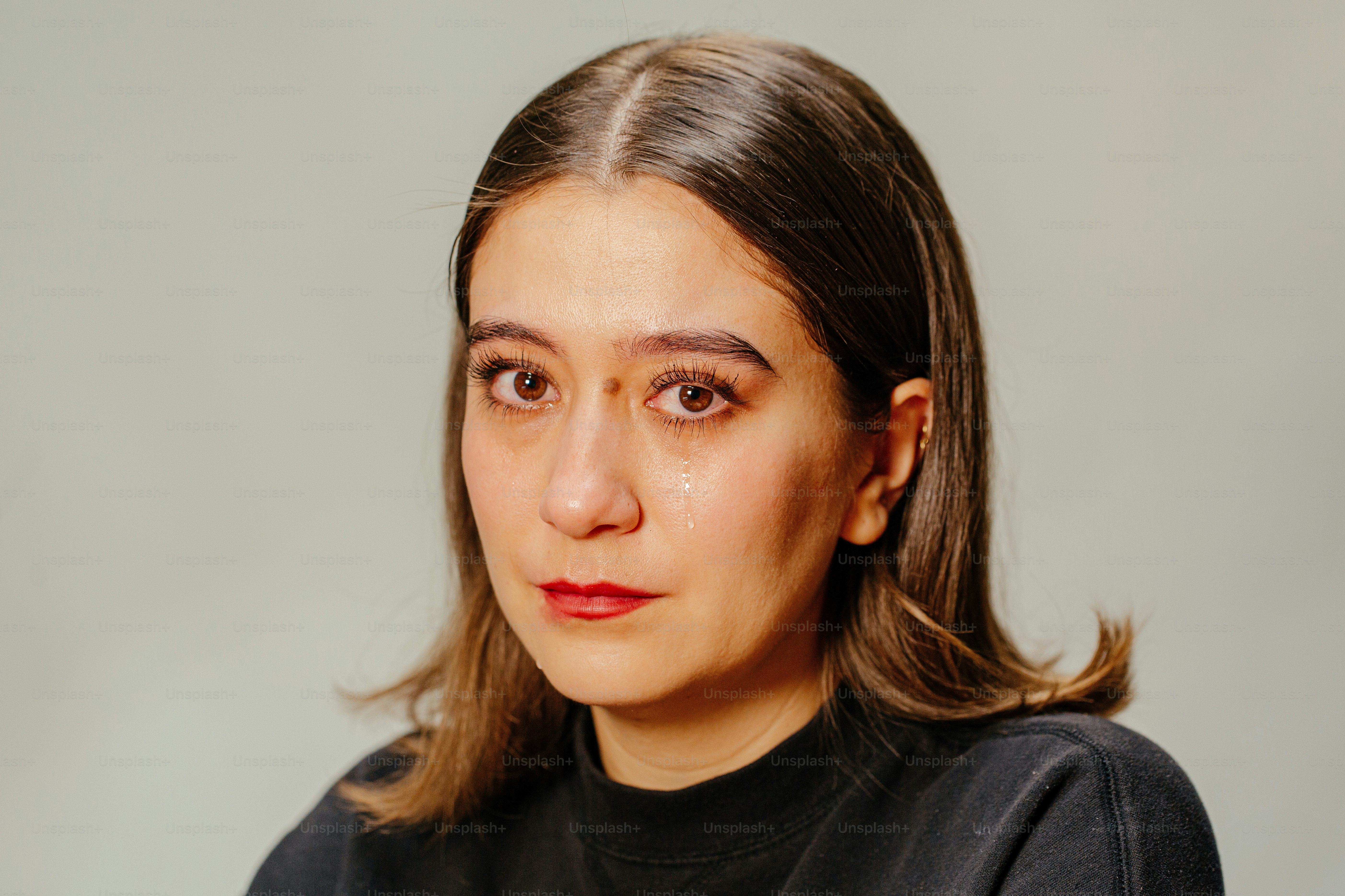 A woman appears to be crying.
