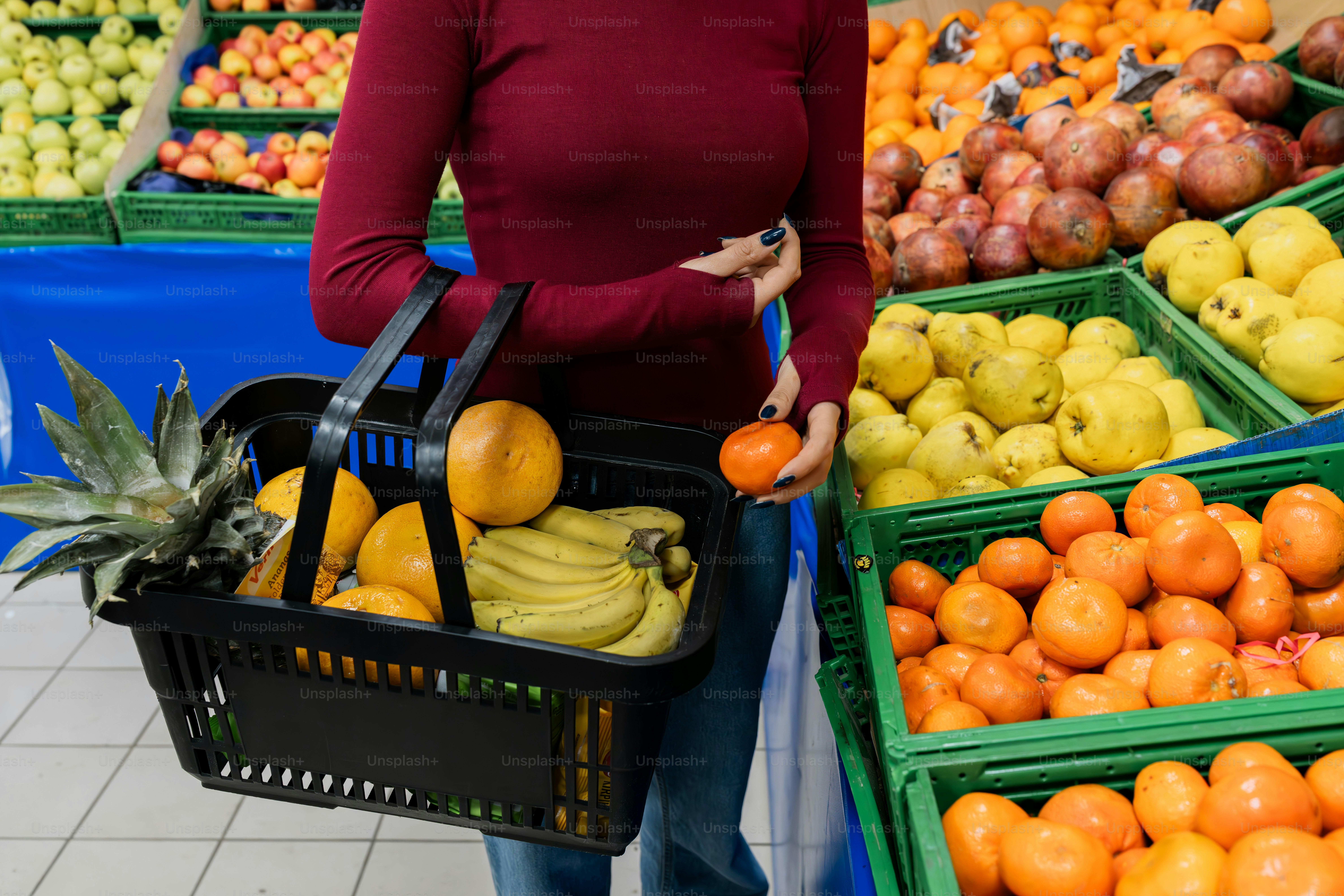 Woman grocery shopping, grabbing items from freezer. photo – Orange ...