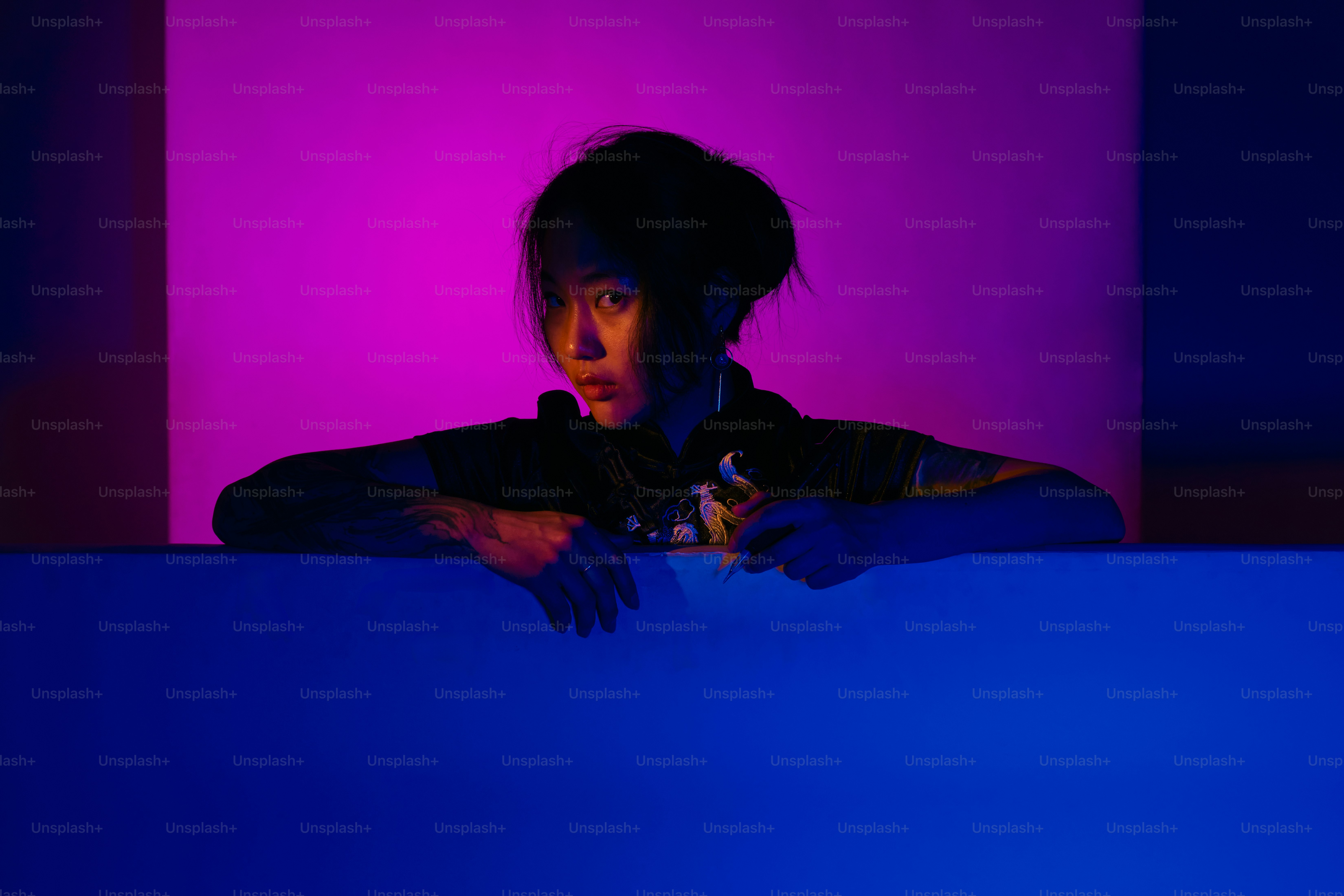 Person is in a room with blue and purple lighting.