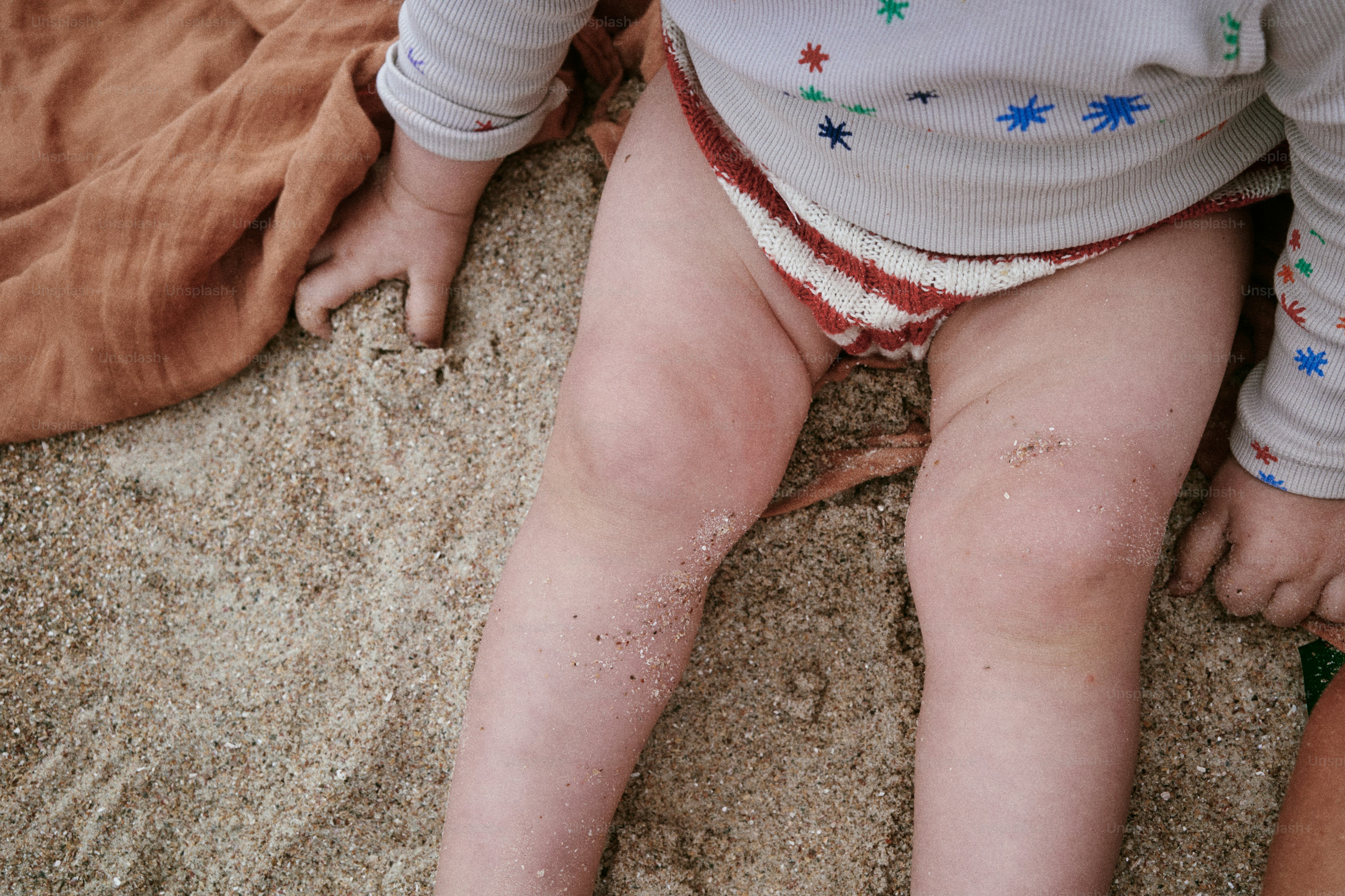 A child plays in the sand