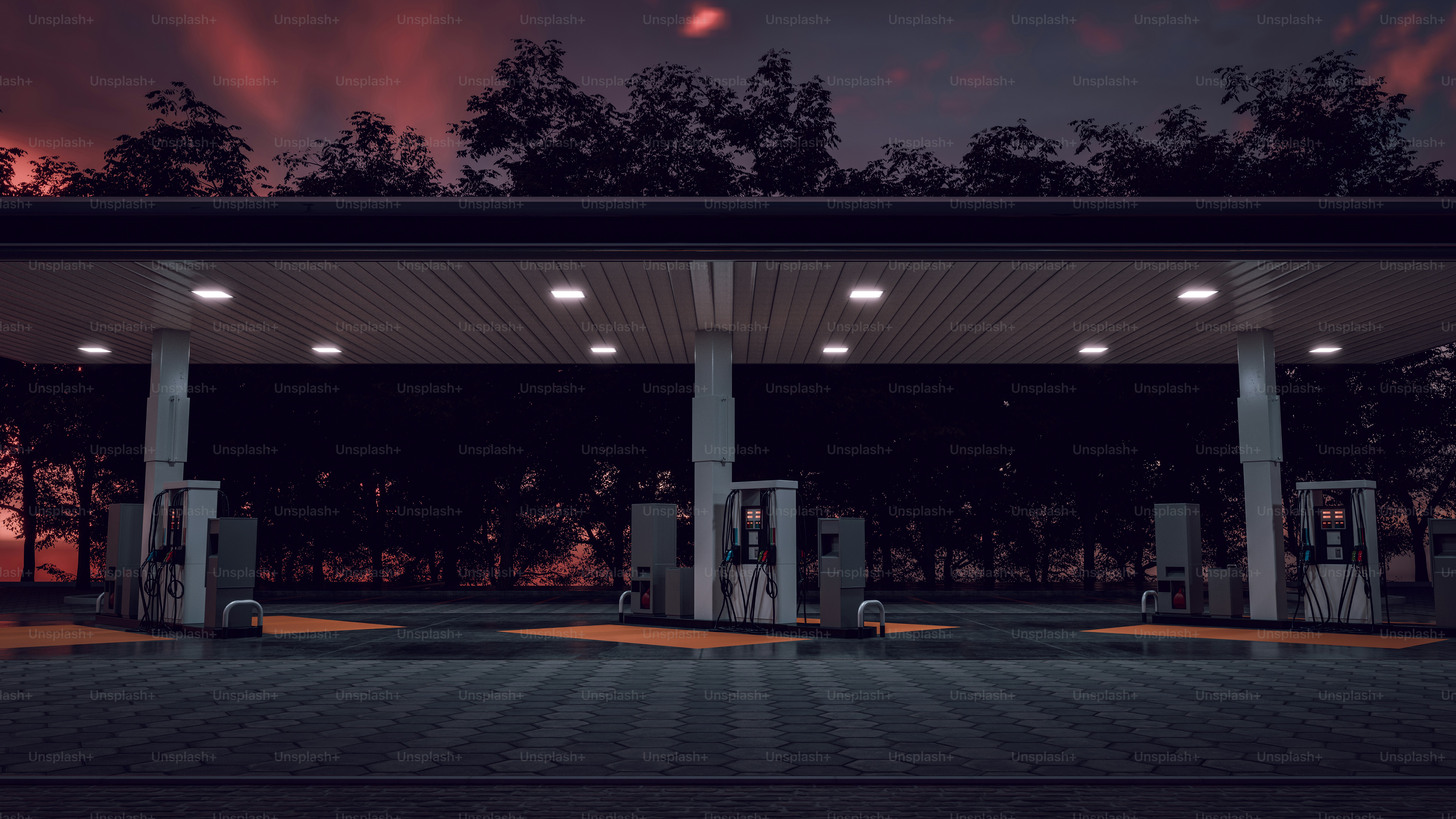 Gas station under a dusky, red sky.