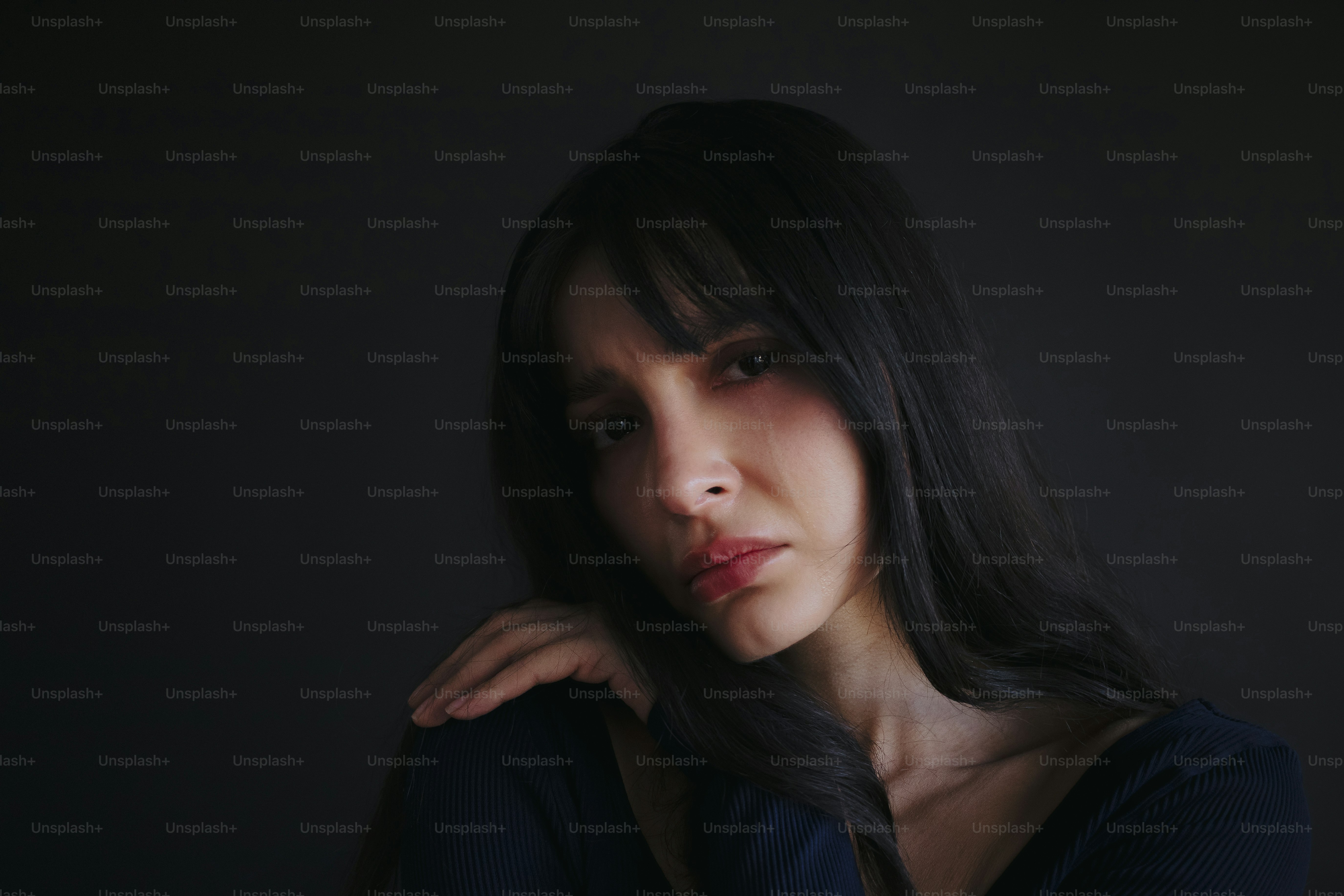 A woman looks sad and appears to be distraught. photo – Depression ...