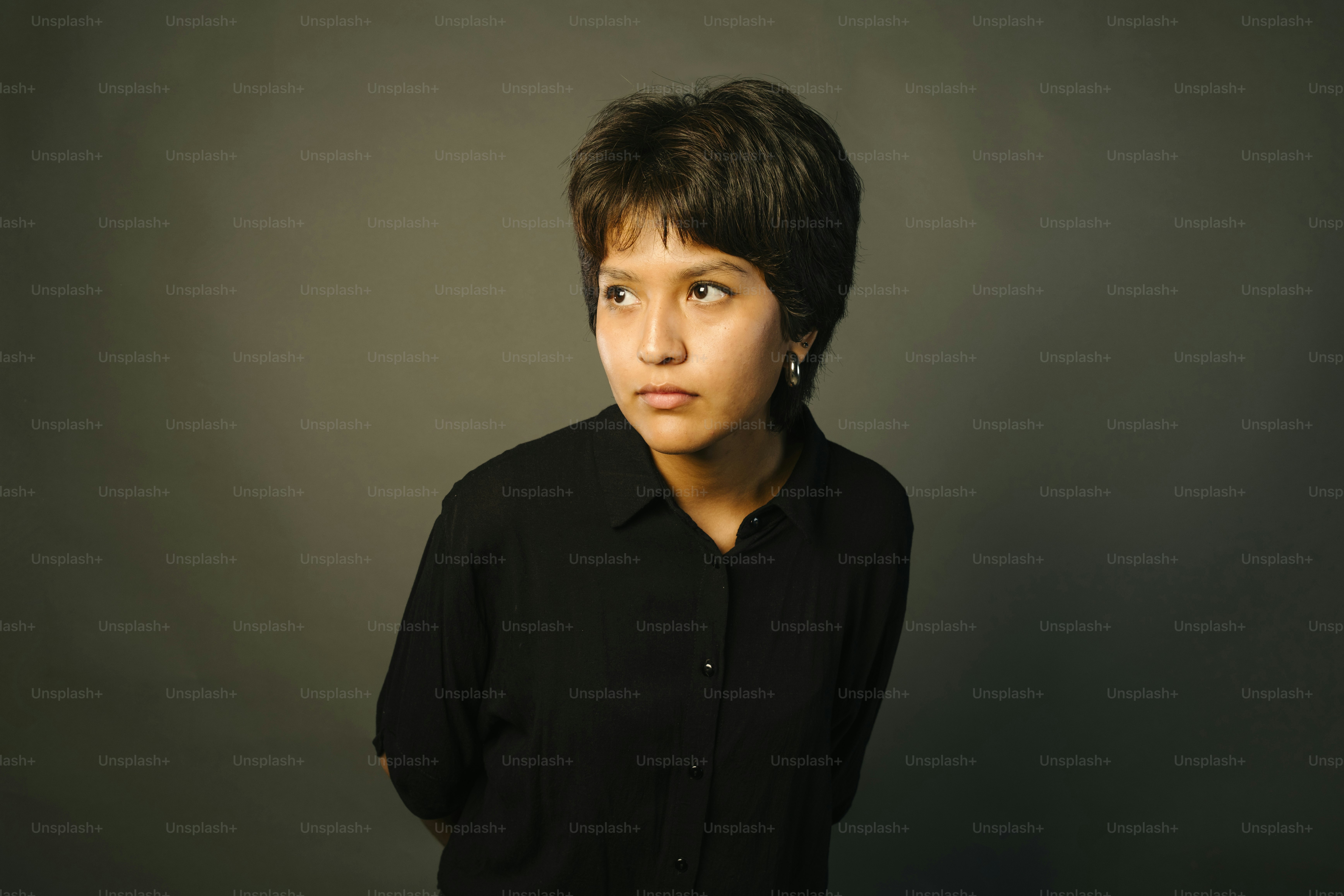 Woman in black shirt looking off to the side