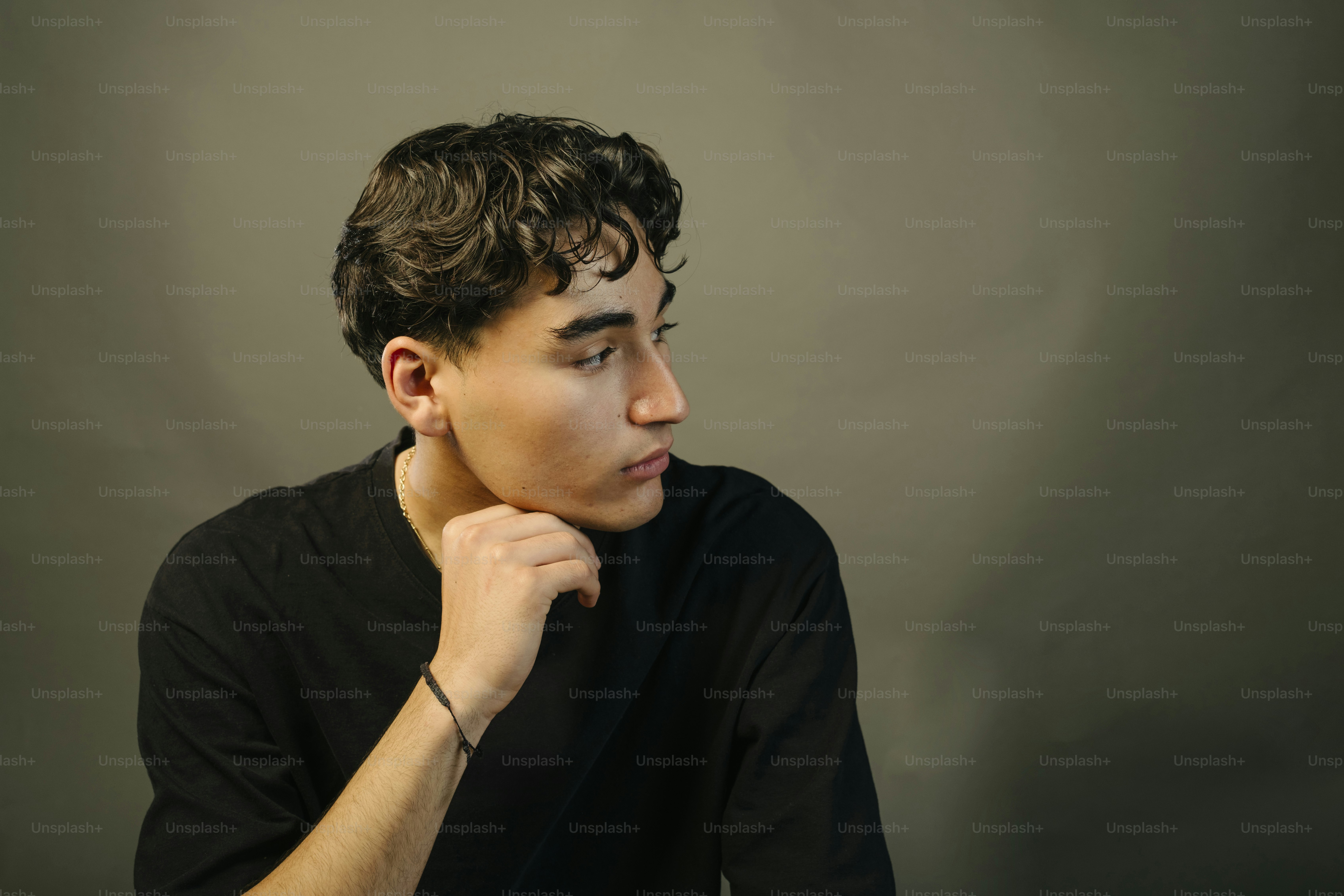 A young man is lost in thought